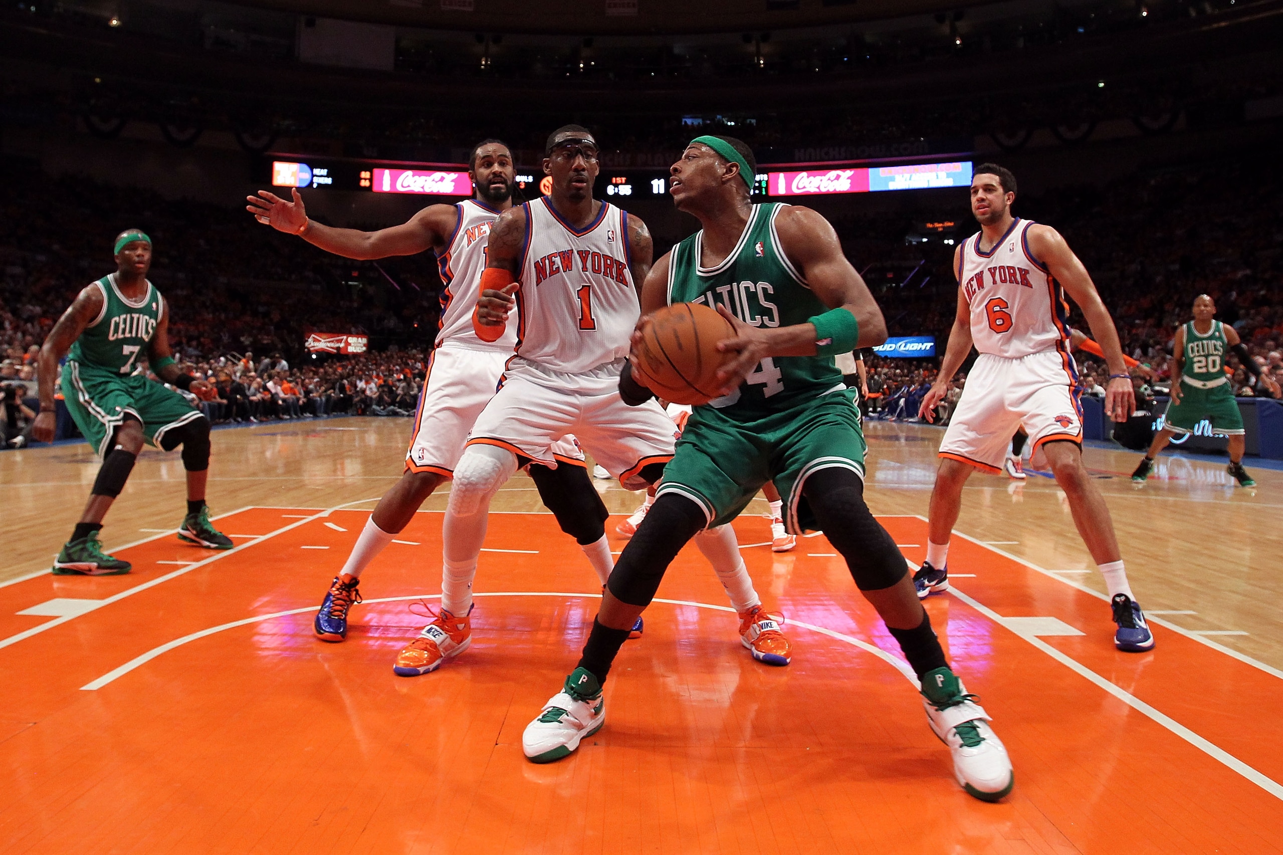 NEW YORK, NY - APRIL 24:  Paul Pierce #34 of the Boston Celtics looks to go up for a shot against Amar'e Stoudemire #1, Ronny Turiaf #14 and Landry Fields #6 of the New York Knicks in Game Four of the Eastern Conference Quarterfinals during the 2011 NBA P