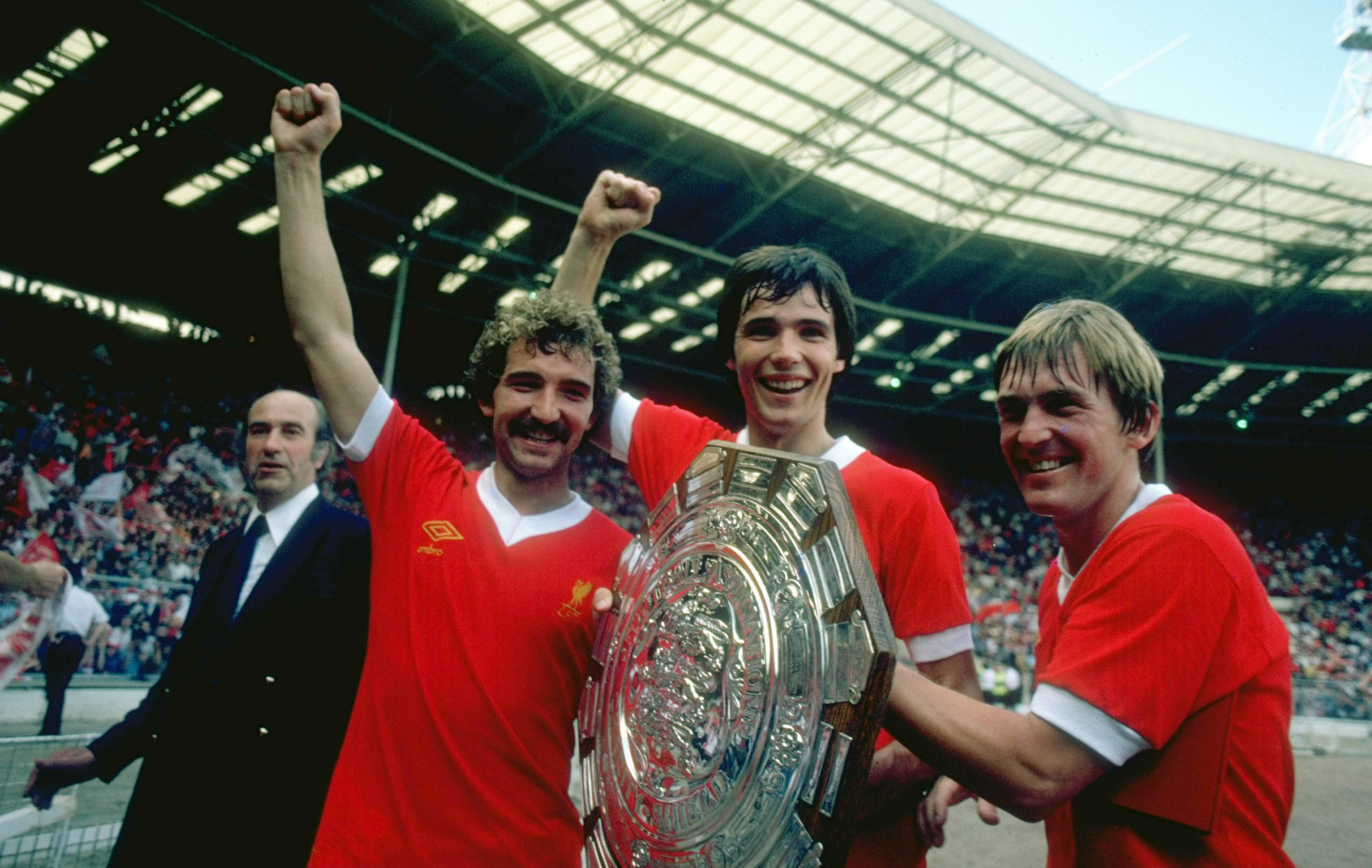 1979:  (Left to right) Graeme Souness, Alan Hansen and Kenny Dalglish of Liverpool hold the trophy after the Charity Shield match against Arsenal at Wembley Stadium in London. Liverpool won the match 3-1. \ Mandatory Credit: Allsport UK /Allsport