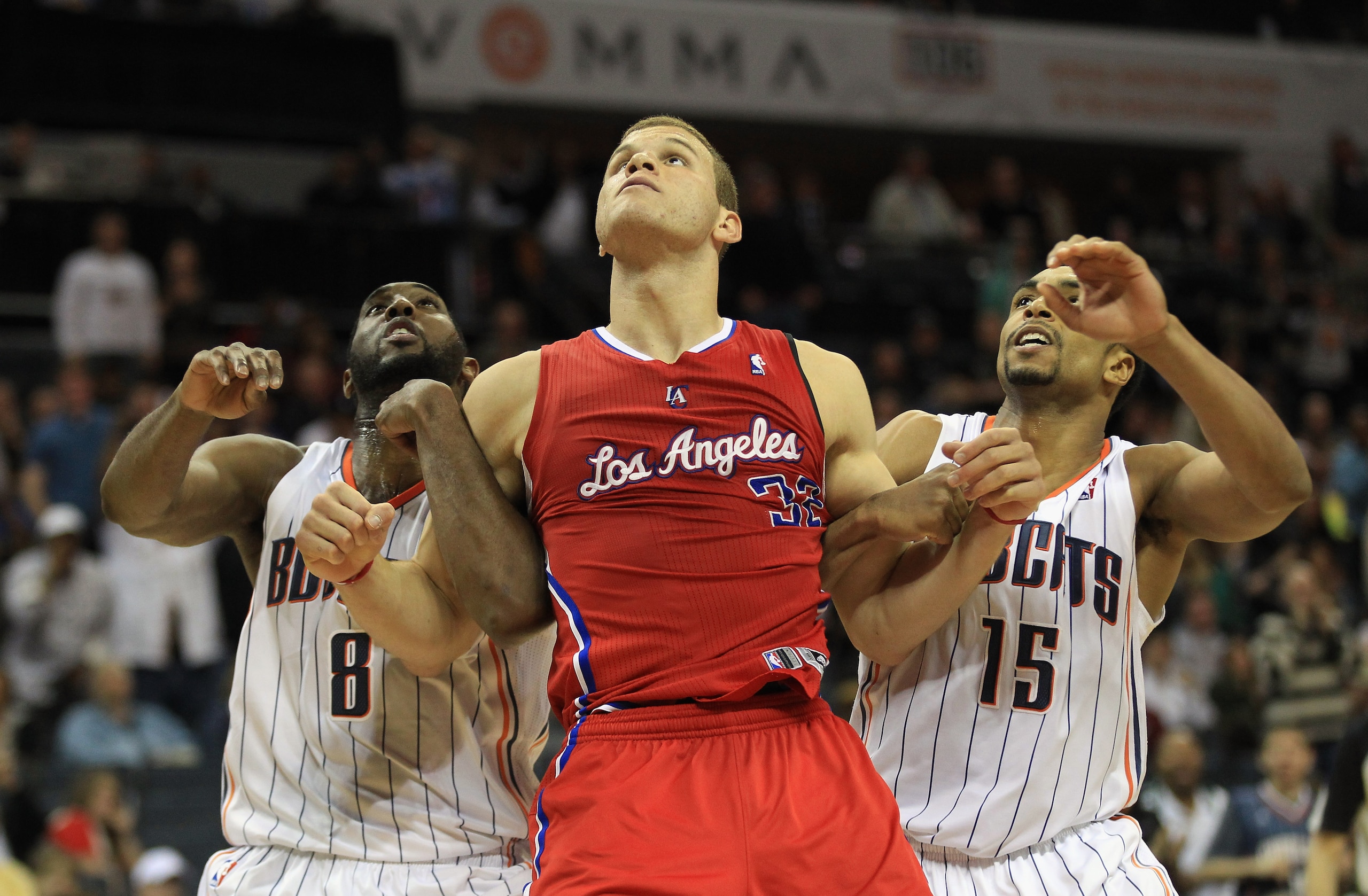 CHARLOTTE, NC - MARCH 07:  Blake Griffin #32 of the Los Angeles Clippers fights for position against DJ White #8 and teammate Gerald Henderson #15 of the Charlotte Bobcats during their game at Time Warner Cable Arena on March 7, 2011 in Charlotte, North C