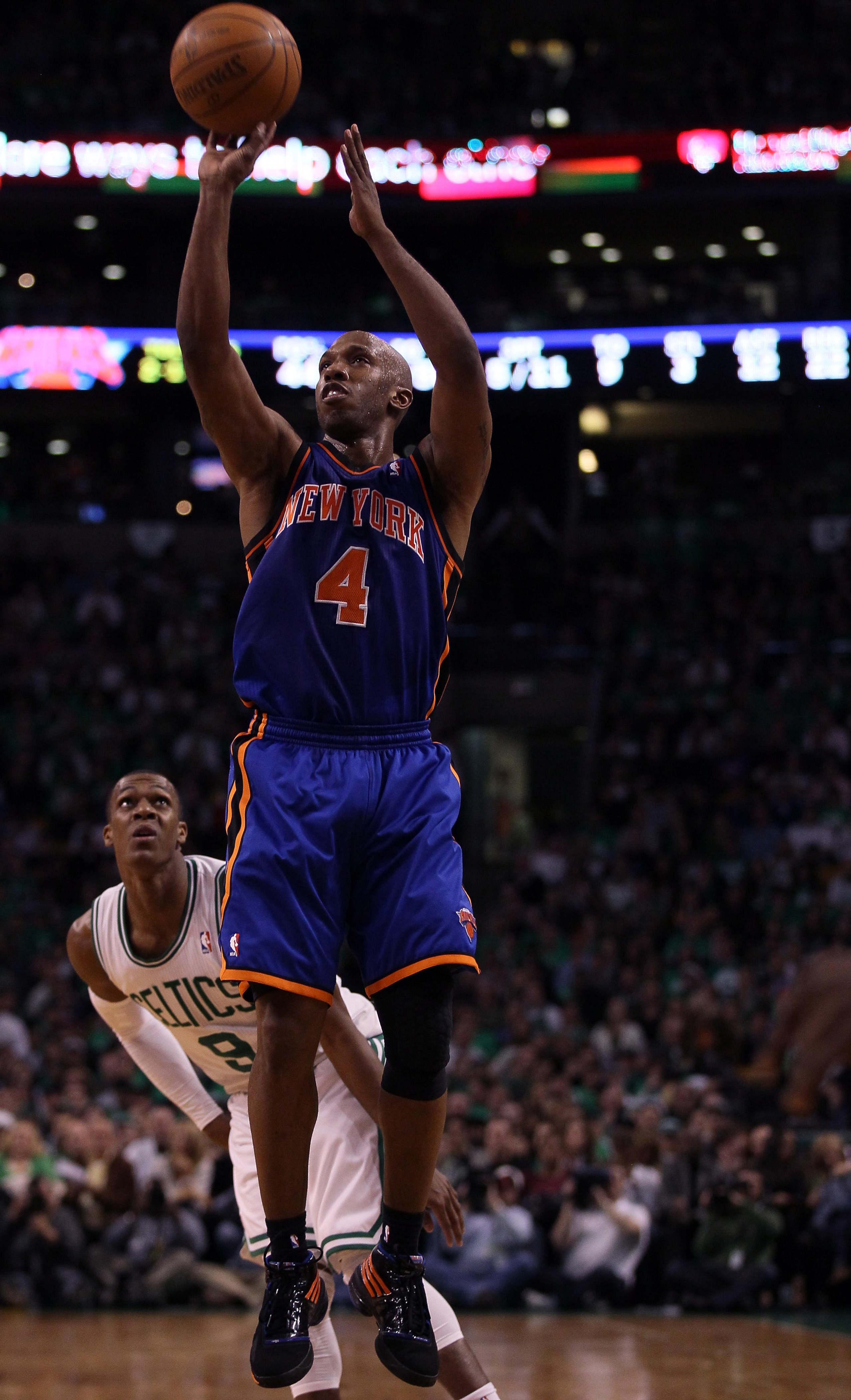 BOSTON, MA - APRIL 17:  Chauncey Billups #4 of the New York Knicks takes a shot as Rajon Rondo #9 of the Boston Celtics defends in Game One of the Eastern Conference Quarterfinals in the 2011 NBA Playoffs on April 17, 2011 at the TD Garden in Boston, Mass