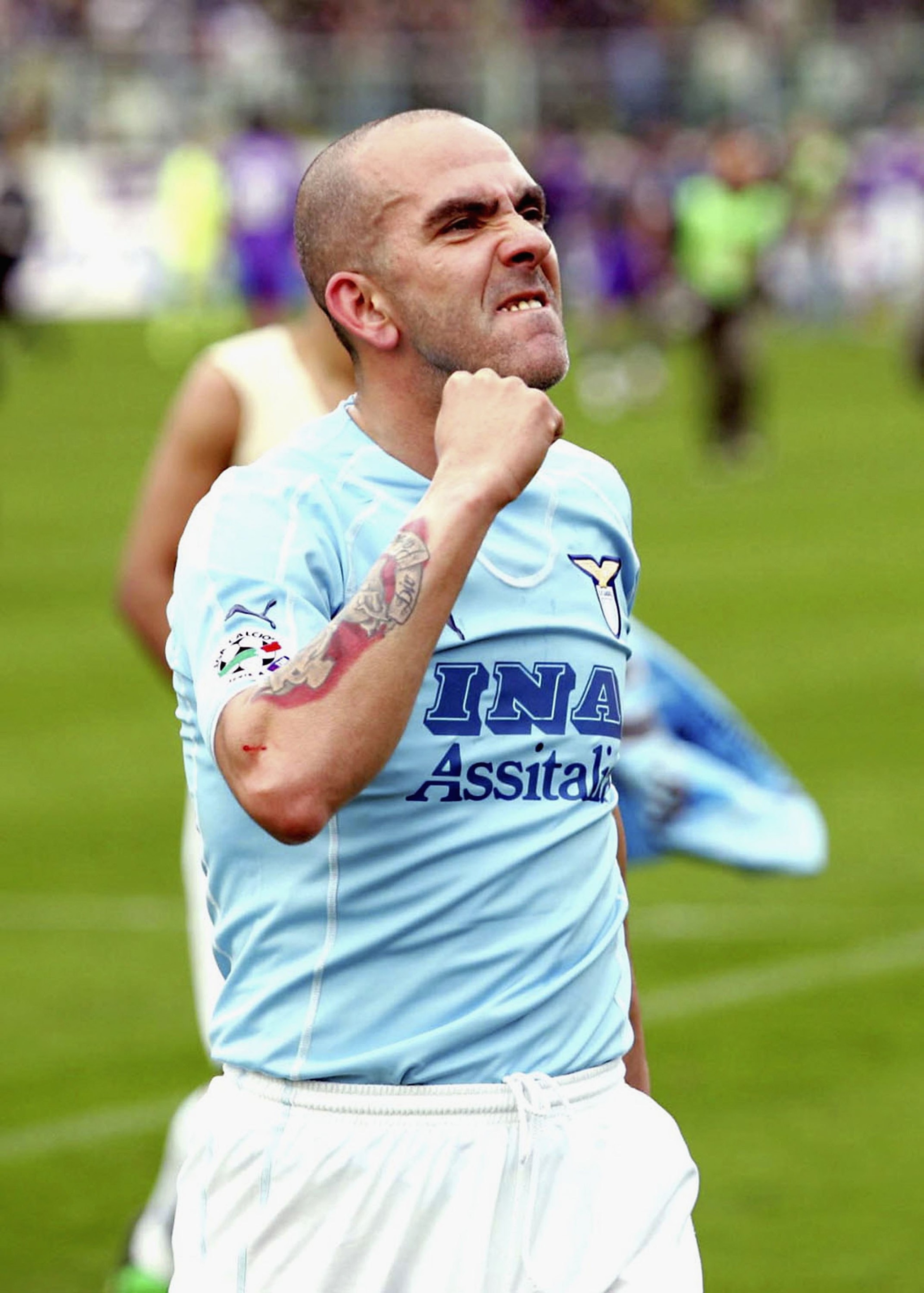 FLORENCE, ITALY - FEBRUARY 19: Paolo Di Canio of Lazio celebrates his teams 2-1 victory after the Serie A match between Fiorentina and SS Lazio at the Stadio Artemio Franchi on February 19, 2006 in Florence, Italy.  (Photo by New Press/Getty Images)