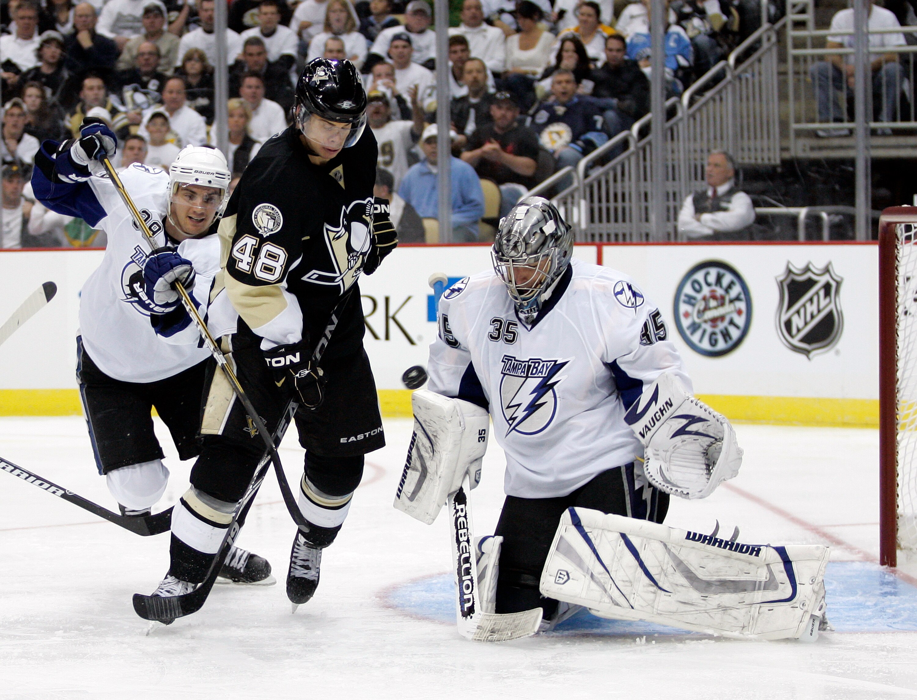 PITTSBURGH, PA - APRIL 13:  Dwayne Roloson #35 of the Tampa Bay Lightning makes a save as Tyler Kennedy #48 of the Pittsburgh Penguins attempts to screen the goaltender in Game One of the Eastern Conference Quarterfinals during the 2011 NHL Stanley Cup Pl