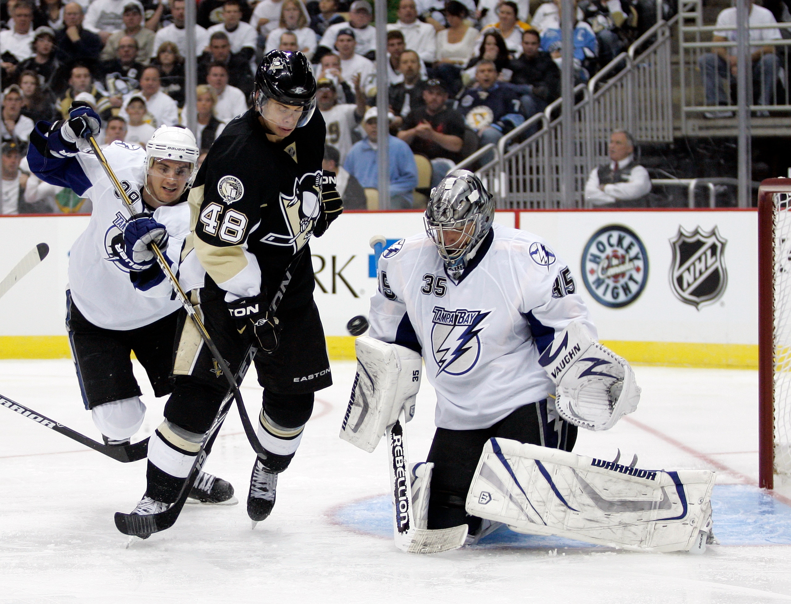 PITTSBURGH, PA - APRIL 13:  Dwayne Roloson #35 of the Tampa Bay Lightning makes a save as Tyler Kennedy #48 of the Pittsburgh Penguins attempts to screen the goaltender in Game One of the Eastern Conference Quarterfinals during the 2011 NHL Stanley Cup Pl