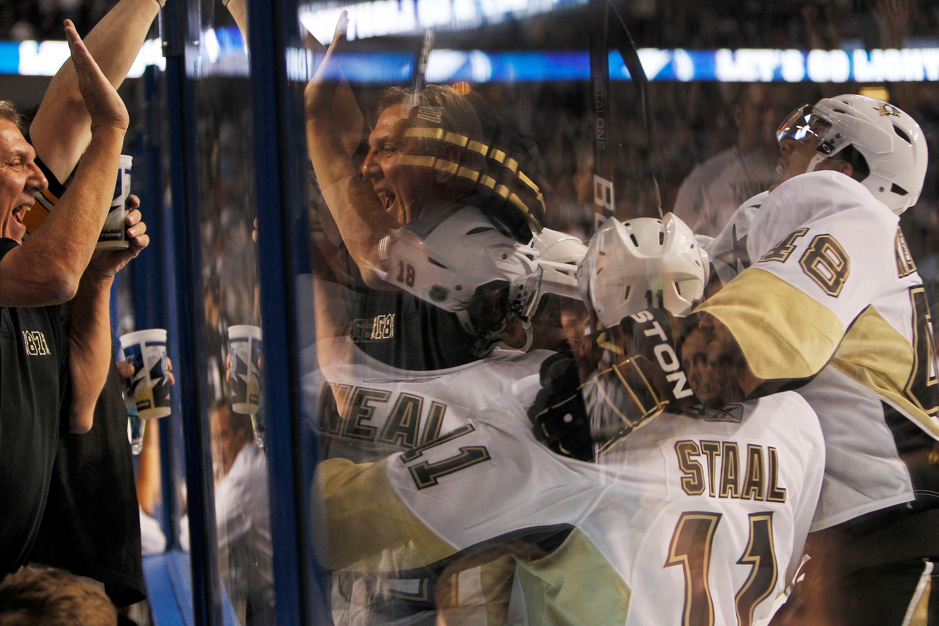 TAMPA, FL - APRIL 20: James Neal #18 of the Pittsburgh Penguins is swarmed by teammates after scoring the game winning goal in the second overtime period against the Tampa Bay Lightning in Game Four of the Eastern Conference Quarterfinals during the 2011