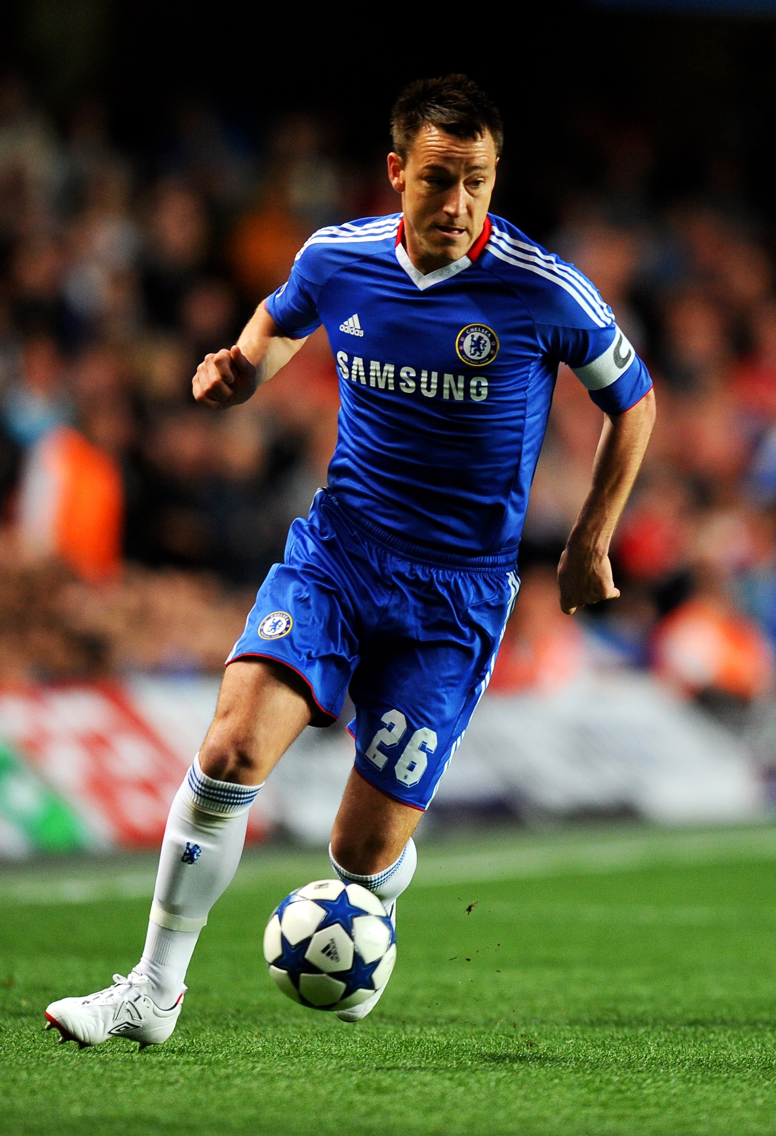 LONDON, ENGLAND - APRIL 06:  John Terry of Chelsea runs with the ball during the UEFA Champions League quarter final first leg match between Chelsea and Manchester United at Stamford Bridge on April 6, 2011 in London, England.  (Photo by Mike Hewitt/Getty