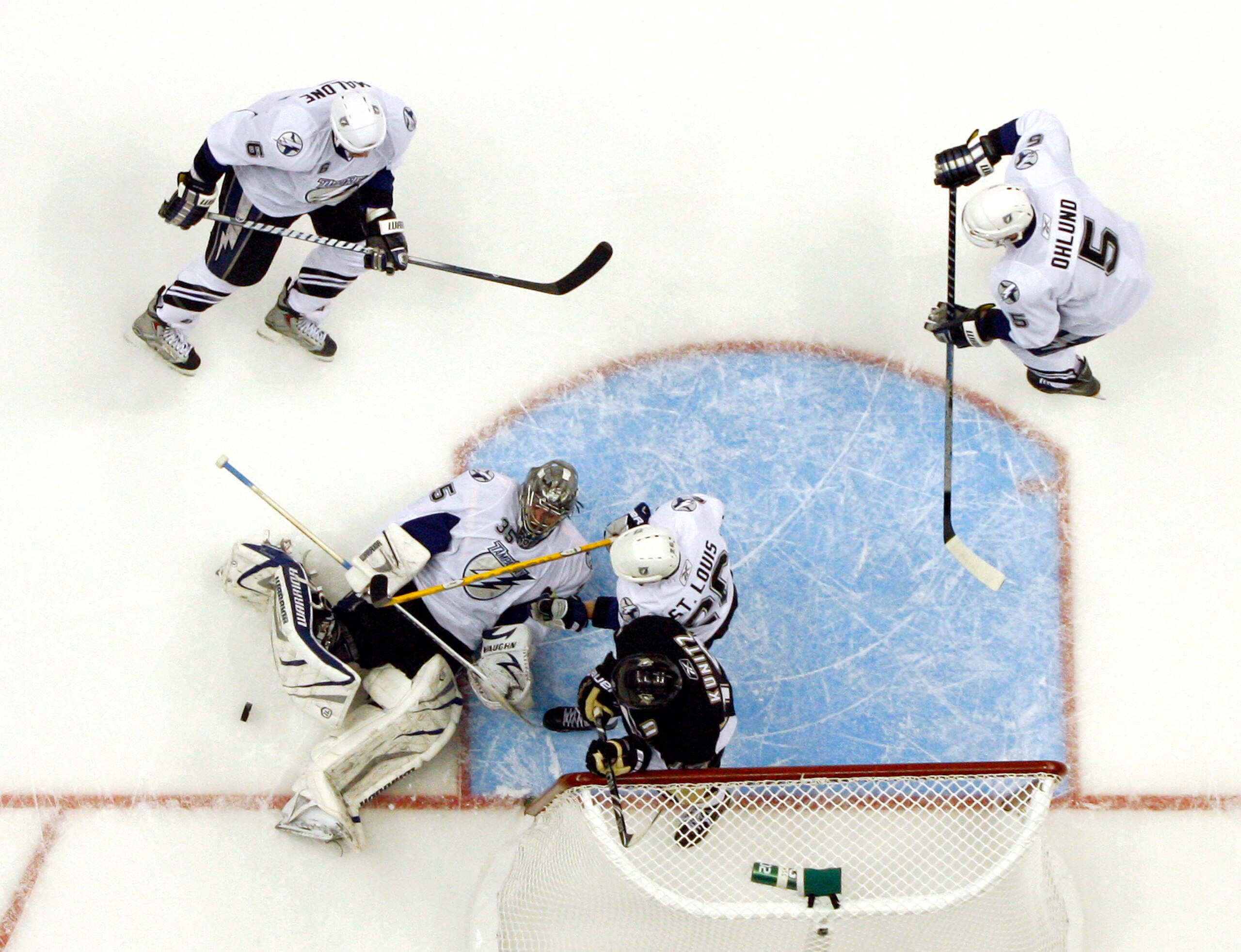 PITTSBURGH, PA - APRIL 23:  Dwayne Roloson #35 of the Tampa Bay Lightning makes a save against the Pittsburgh Penguins in Game Five of the Eastern Conference Quarterfinals during the 2011 NHL Stanley Cup Playoffs at Consol Energy Center on April 23, 2011