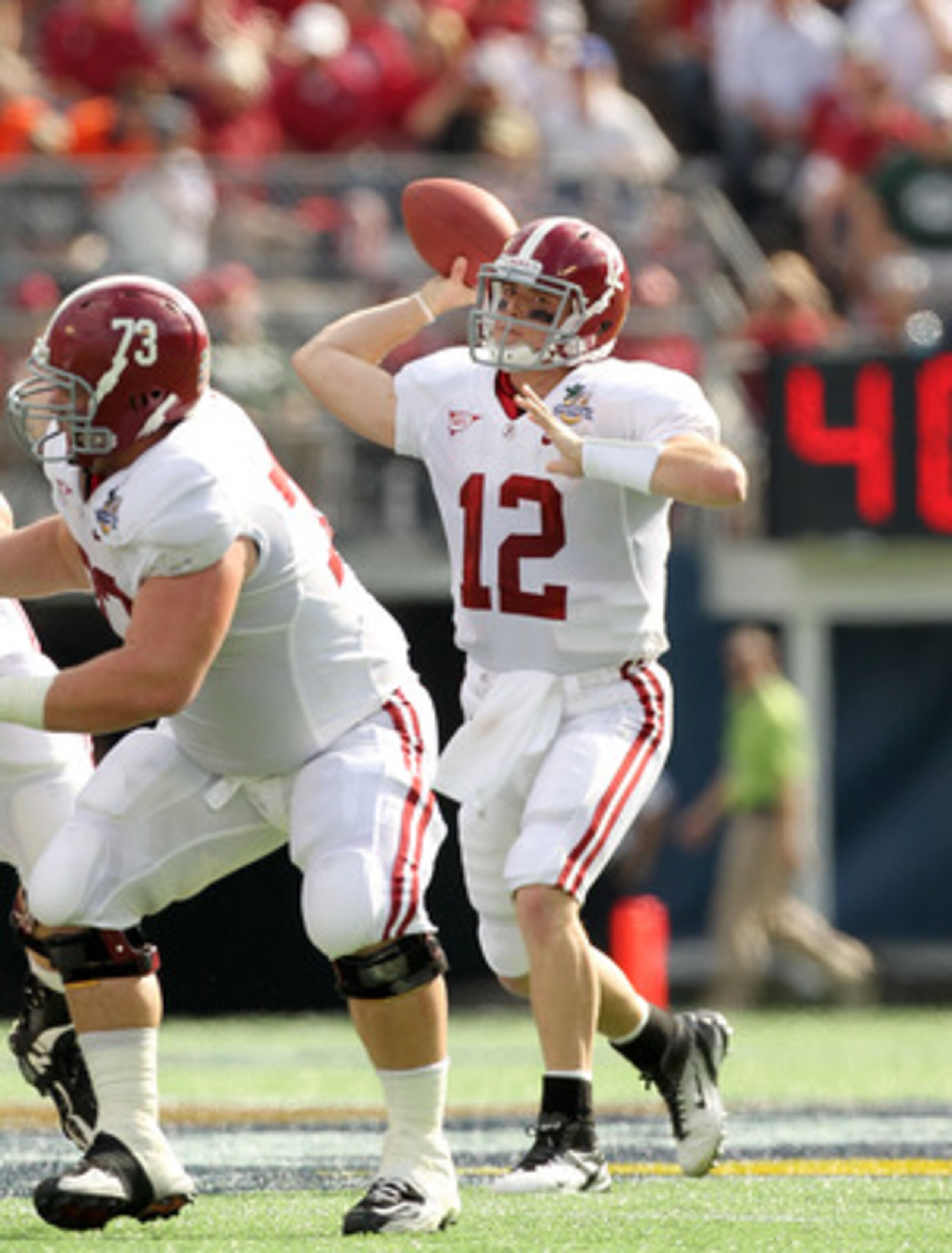 ORLANDO, FL - JANUARY 01:  Greg McElroy #12 of the Alabama Crimson Tide passes the ball during the Capitol One Bowl against the Michigan State Spartans at the Florida Citrus Bowl on January 1, 2011 in Orlando, Florida.  (Photo by Mike Ehrmann/Getty Images