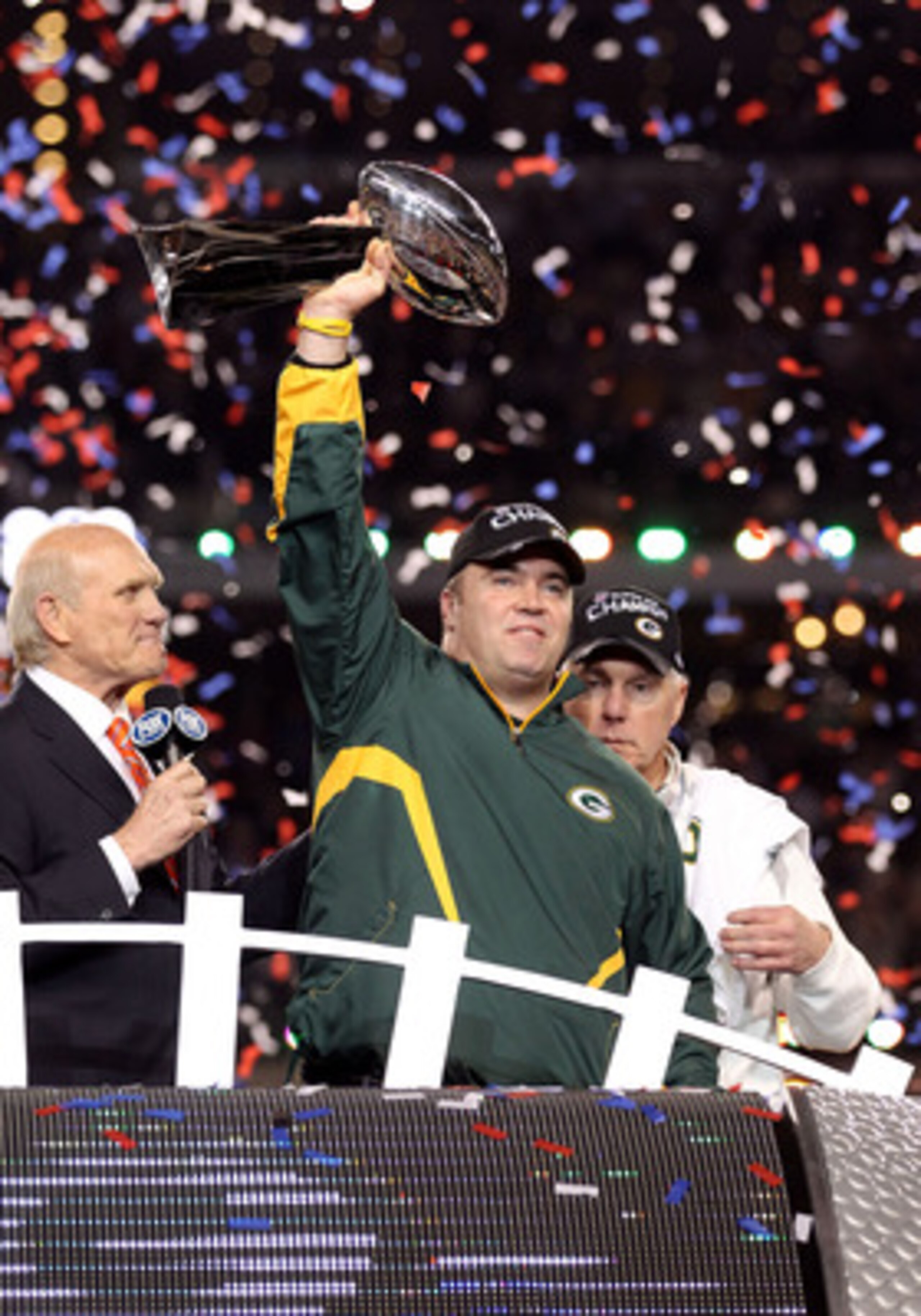 ARLINGTON, TX - FEBRUARY 06:  Head coach Mike McCarthy of the Green Bay Packers celebrates with the Vince Lombardi trophy following the Packers 31-25 win in Super Bowl XLV at Cowboys Stadium on February 6, 2011 in Arlington, Texas.  (Photo by Al Bello/Get