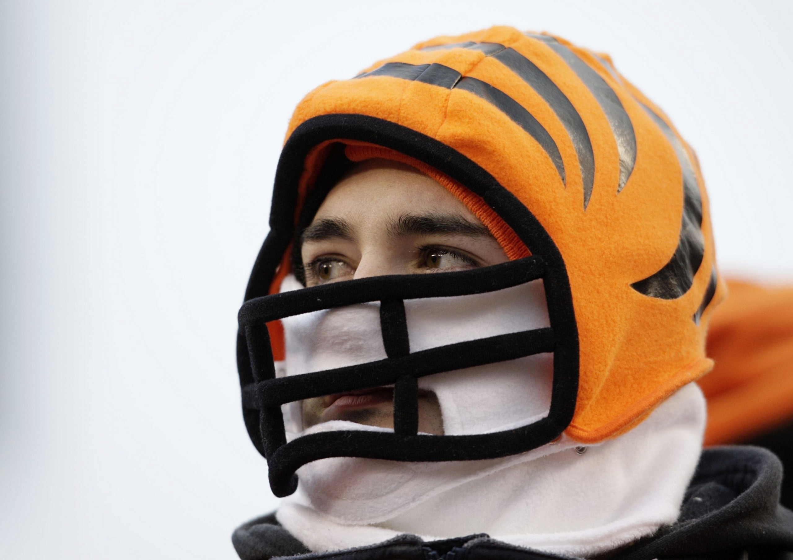 CINCINNATI - JANUARY 9:  A fan of the Cincinnati Bengals watches from the stands during the 2010 AFC wild-card playoff game against the New York Jets at Paul Brown Stadium on January 9, 2010 in Cincinnati, Ohio. (Photo by Andy Lyons/Getty Images)