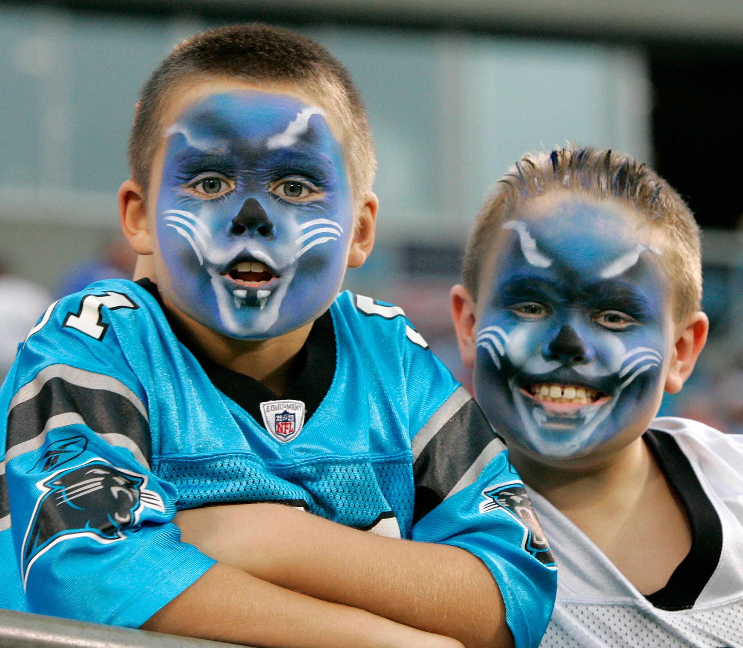 CHARLOTTE, NC - AUGUST 21:  Young Carolina Panthers fans show off their Panther spirt before the start of their preseason game against the New York Jets at Bank of America Stadium on August 21, 2010 in Charlotte, North Carolina. (Photo by Mary Ann Chastai