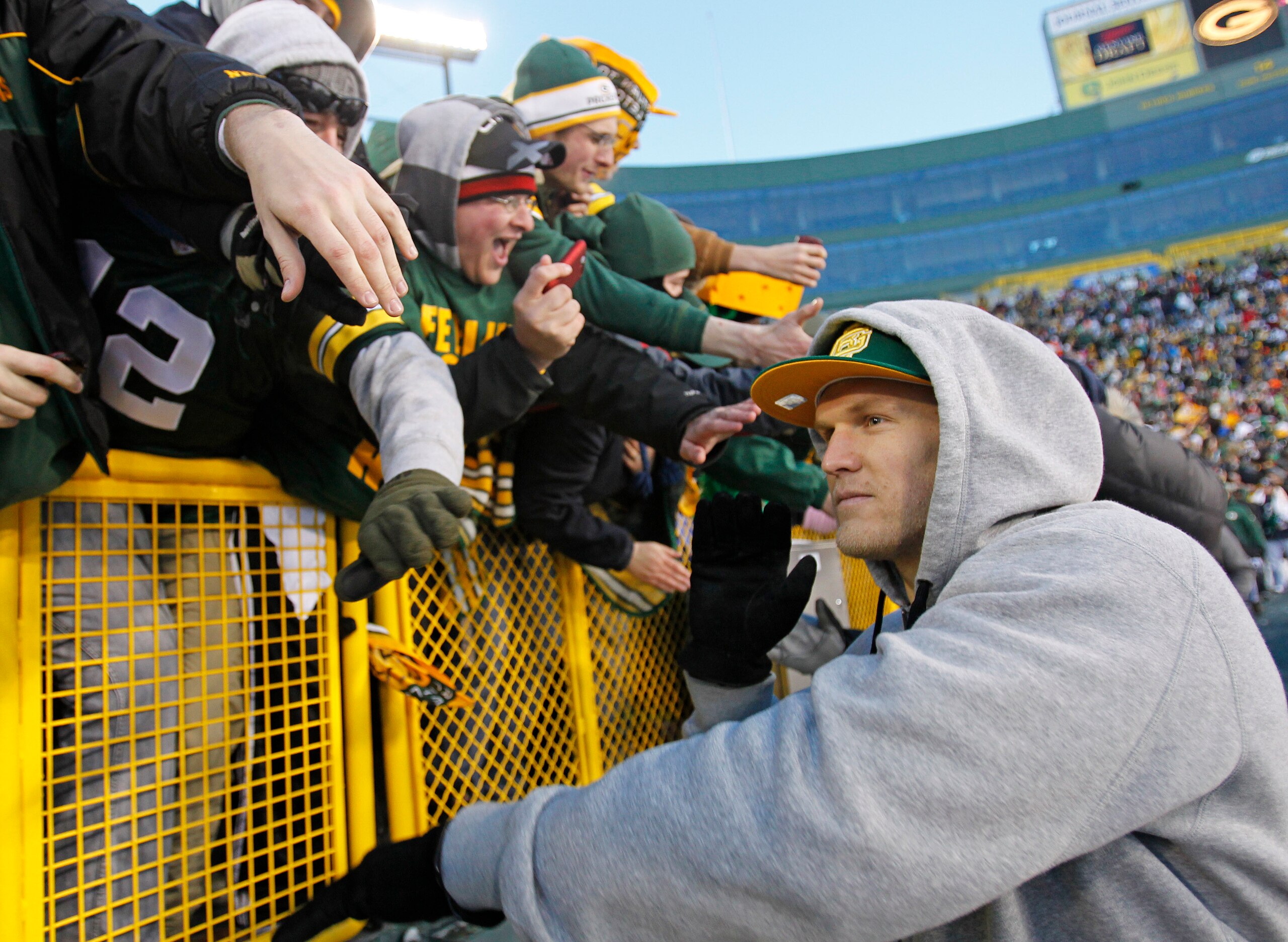 GREEN BAY, WI - FEBRUARY 08:  Green Bay Packers linebacker Clay Matthews slaps the hands of fans as he leaves the field after the Packers victory ceremony at Lambeau Field on February 8, 2011 in Green Bay, Wisconsin.  (Photo by Matt Ludtke/Getty Images)