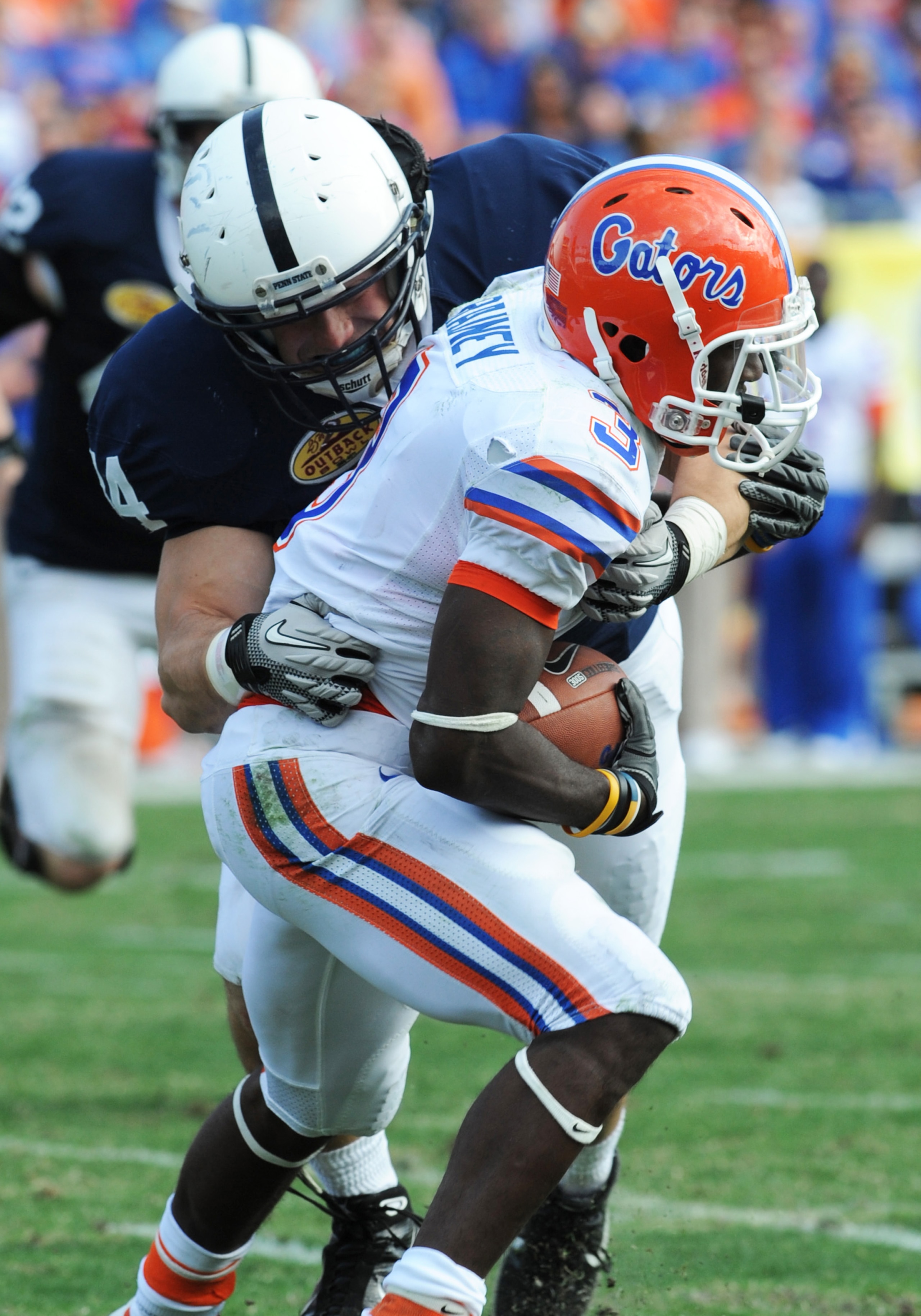 TAMPA, FL - JANUARY 1:  Linebacker Nate Stupar #34 of the Penn State Nittany Lions tackles wire receiver Chris Rainey #3 of the Florida Gators January 1, 2010 in the 25th Outback Bowl at Raymond James Stadium in Tampa, Florida.  (Photo by Al Messerschmidt