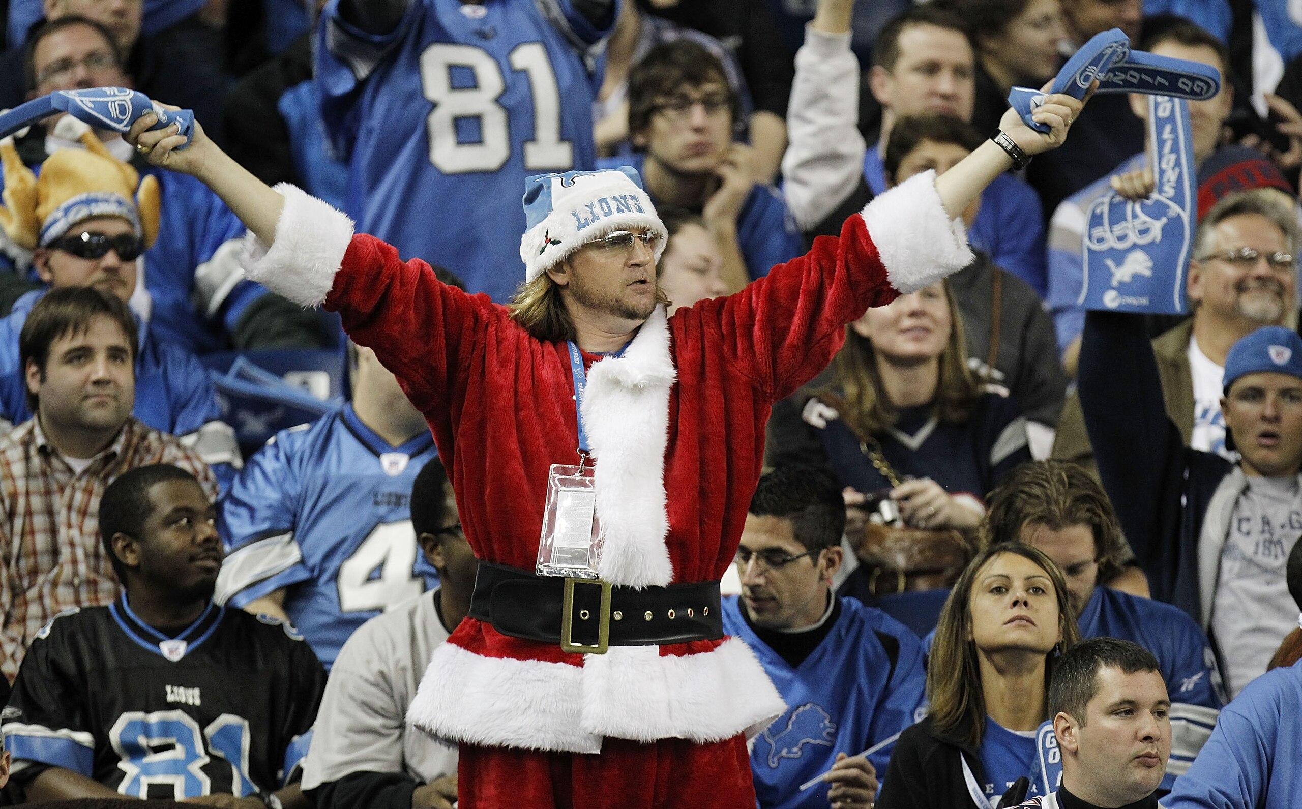 DETROIT - NOVEMBER 25: A fan cheers during a game between the New England Patriots and the Detroit Lions on November 25, 2010 at Ford Field in Detroit, Michigan. New England won the game 45-24. (Photo by Gregory Shamus/Getty Images)
