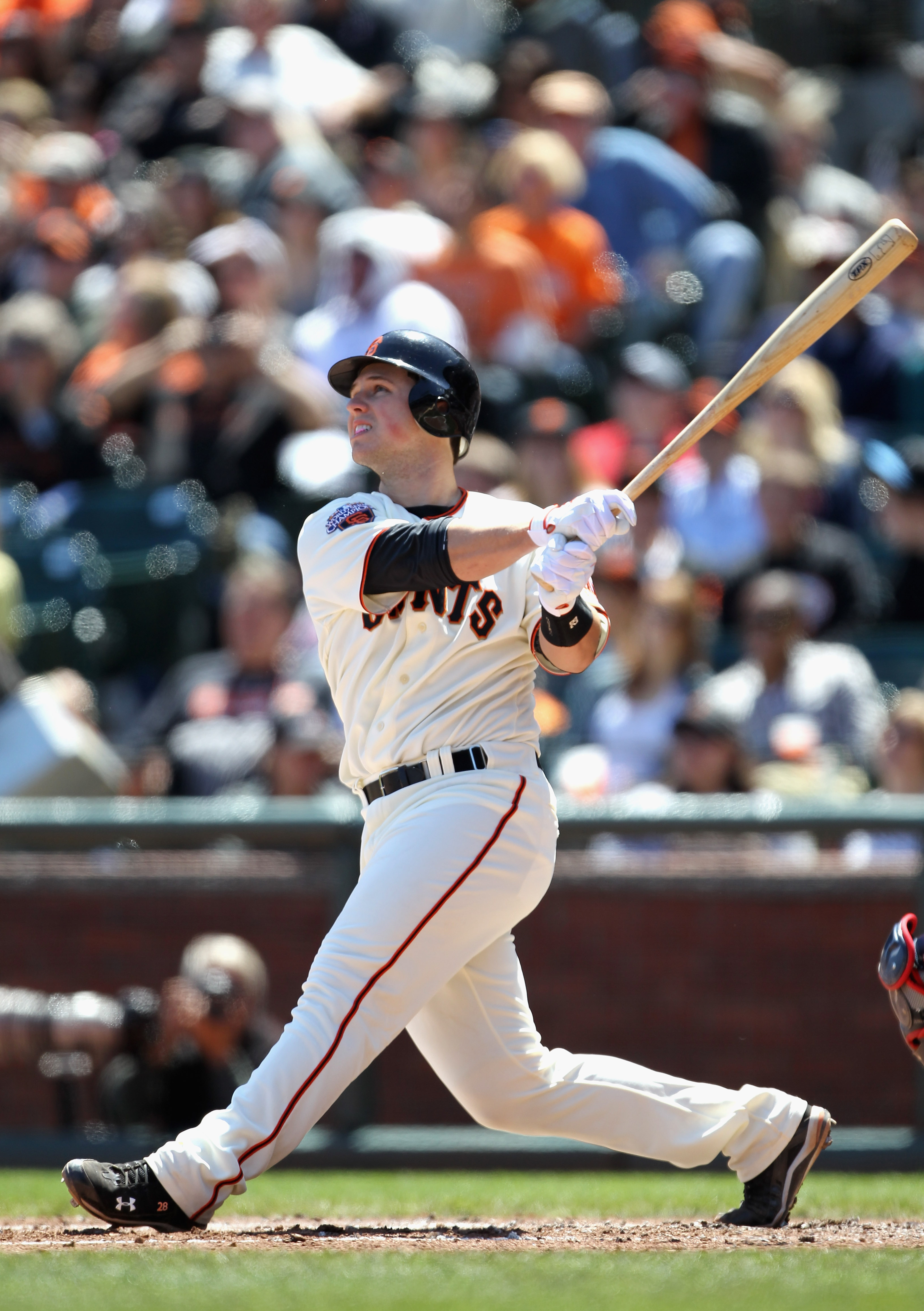 SAN FRANCISCO, CA - APRIL 24:  Buster Posey #28 of the San Francisco Giants hits a two run home run in the fourth inning outfield their game against the Atlanta Braves at AT&T Park on April 24, 2011 in San Francisco, California.  (Photo by Ezra Shaw/Getty