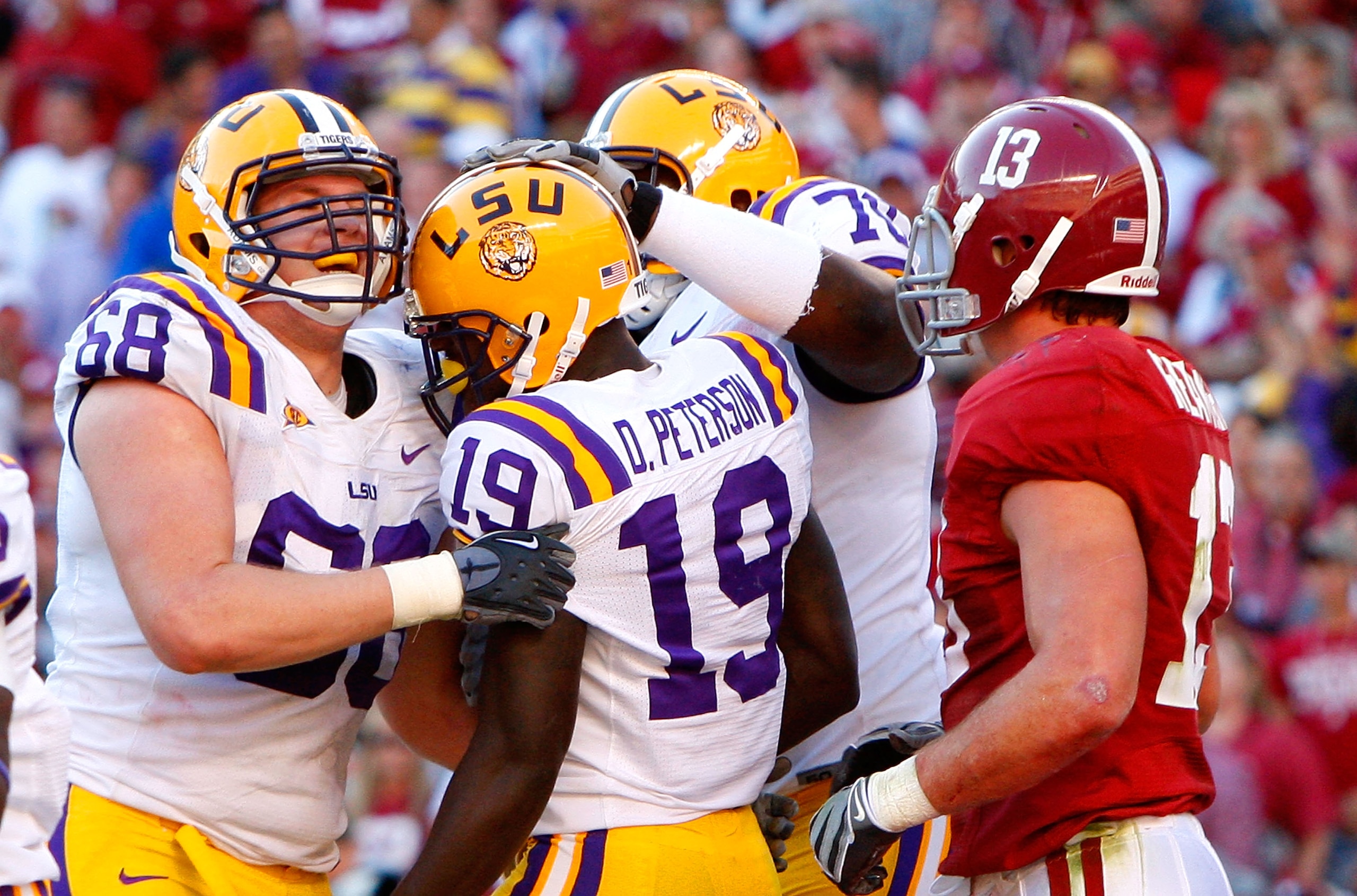 TUSCALOOSA, AL - NOVEMBER 07: Deangelo Peterson #19 of the Louisiana State University Tigers celebrates his touchdown against Cory Reamer #13 of the Alabama Crimson Tide with Josh Dworaczyk #68 and Ciron Black #70 at Bryant-Denny Stadium on November 7, 2 TUSCALOOSA, AL - NOVEMBER 07: Deangelo Peterson #19 of the Louisiana State University Tigers celebrates his touchdown against Cory Reamer #13 of the Alabama Crimson Tide with Josh Dworaczyk #68 and Ciron Black #70 at Bryant-Denny Stadium on November 7, 2