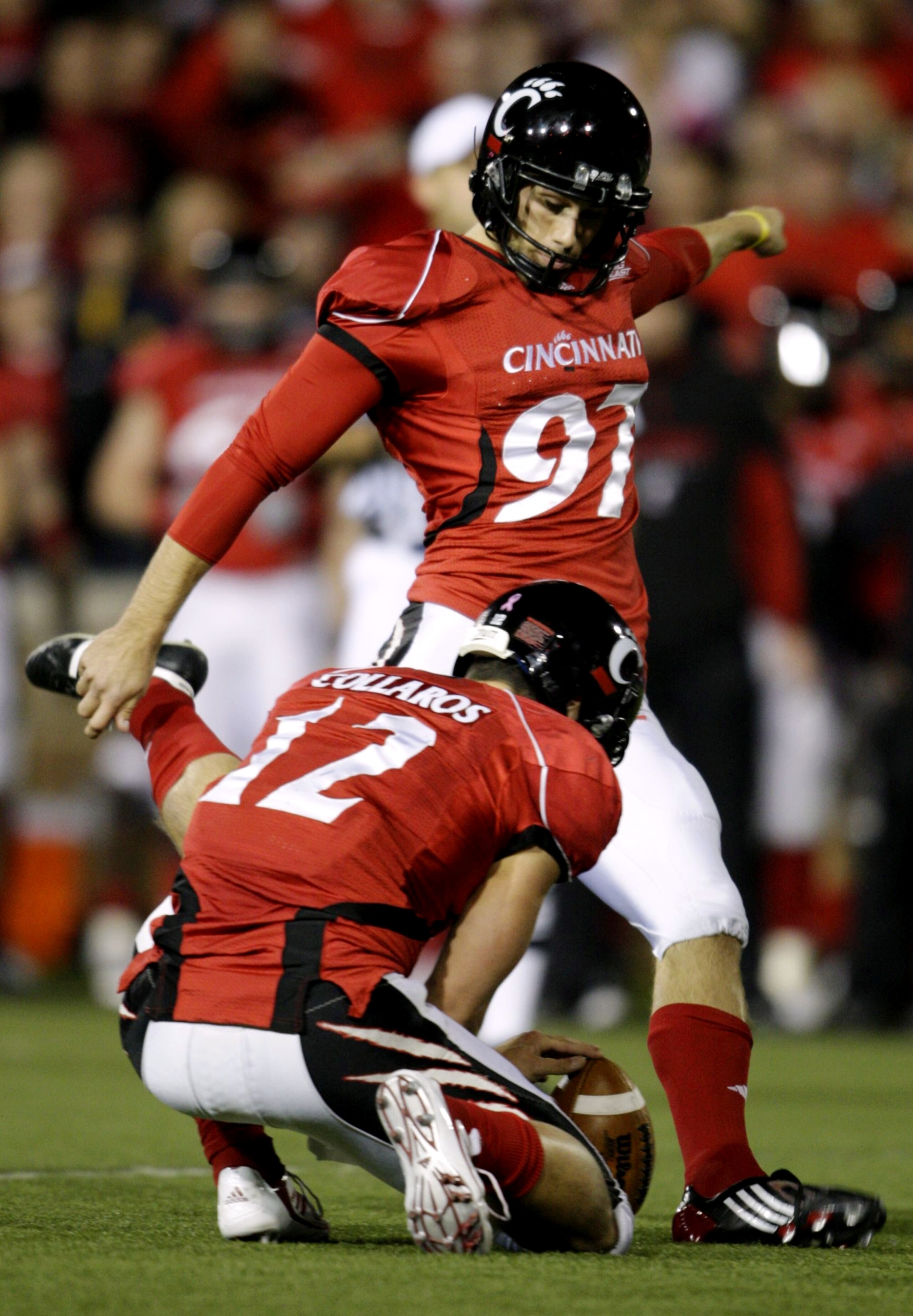 CINCINNATI - NOVEMBER 13:  Jake Rogers #97 of the Cincinnati Bearcats kicks a 38 yard field goal in the fourth quarter against the West Virginia Mountaineers at Nippert Stadium on November 13, 2009 in Cincinnati, Ohio.  (Photo by Andy Lyons/Getty Images)