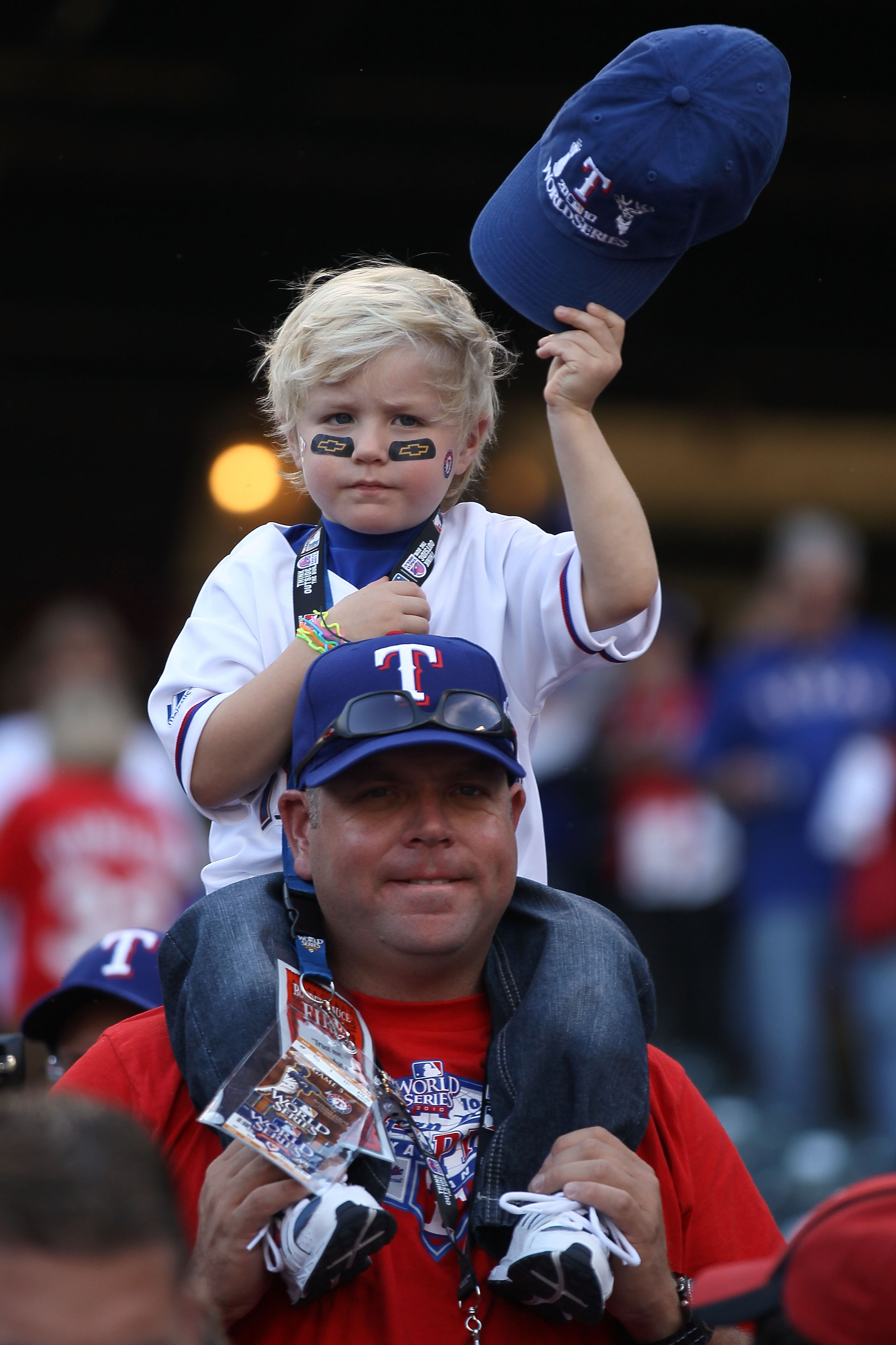 ARLINGTON, TX - NOVEMBER 01:  Fans of the Texas Rangers watch batting practice prior to the Rangers playing against the San Francisco Giants in Game Five of the 2010 MLB World Series at Rangers Ballpark in Arlington on November 1, 2010 in Arlington, Texas