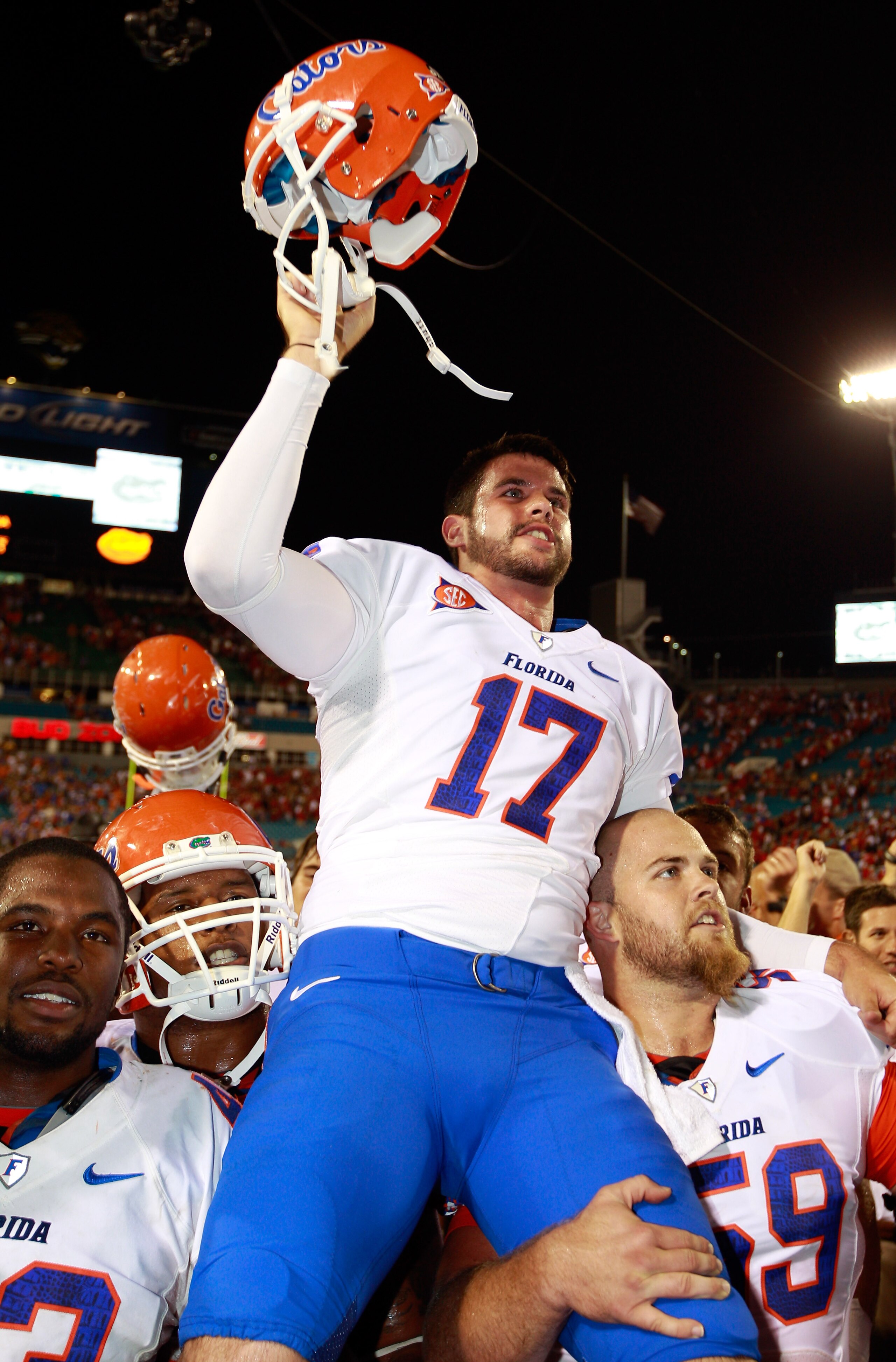 JACKSONVILLE, FL - OCTOBER 30:  Chas Henry #17 of the Florida Gators raises his helmet in vicrtory following the game against the Georgia Bulldogs at EverBank Field on October 30, 2010 in Jacksonville, Florida.  (Photo by Sam Greenwood/Getty Images)