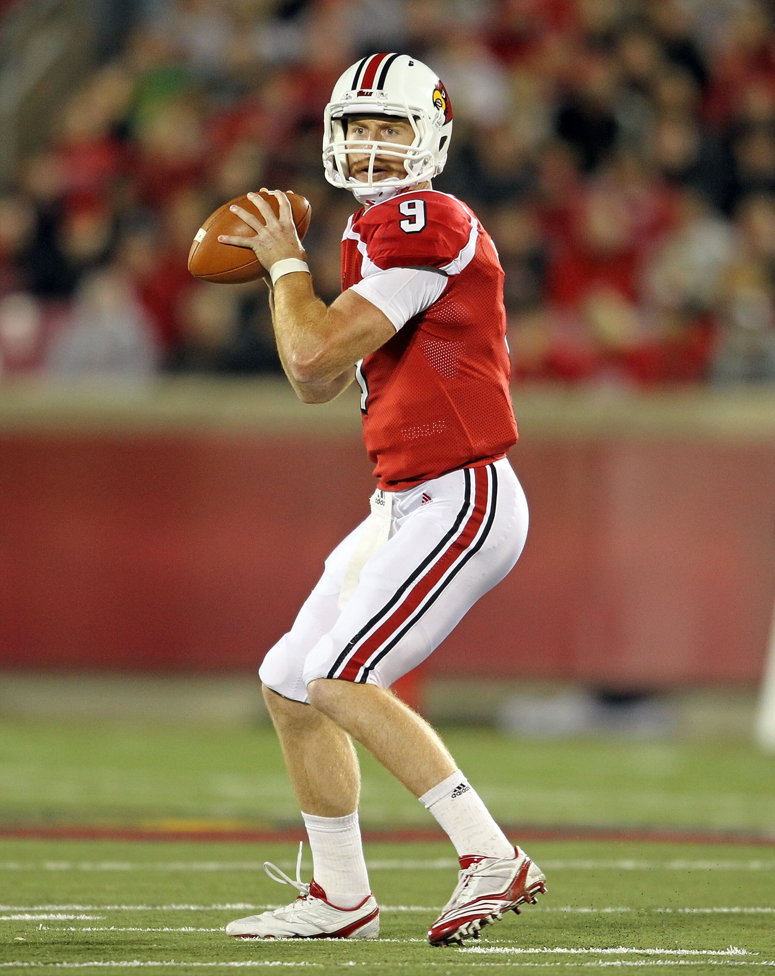 LOUISVILLE, KY - OCTOBER 15: Adam Froman #9 of  the Louisville Cardinals throws a pass during the Big East Conference game against the Cincinnati Bearcats at Papa John's Cardinal Stadium on October 15, 2010 in Louisville, Kentucky.  (Photo by Andy Lyons/G