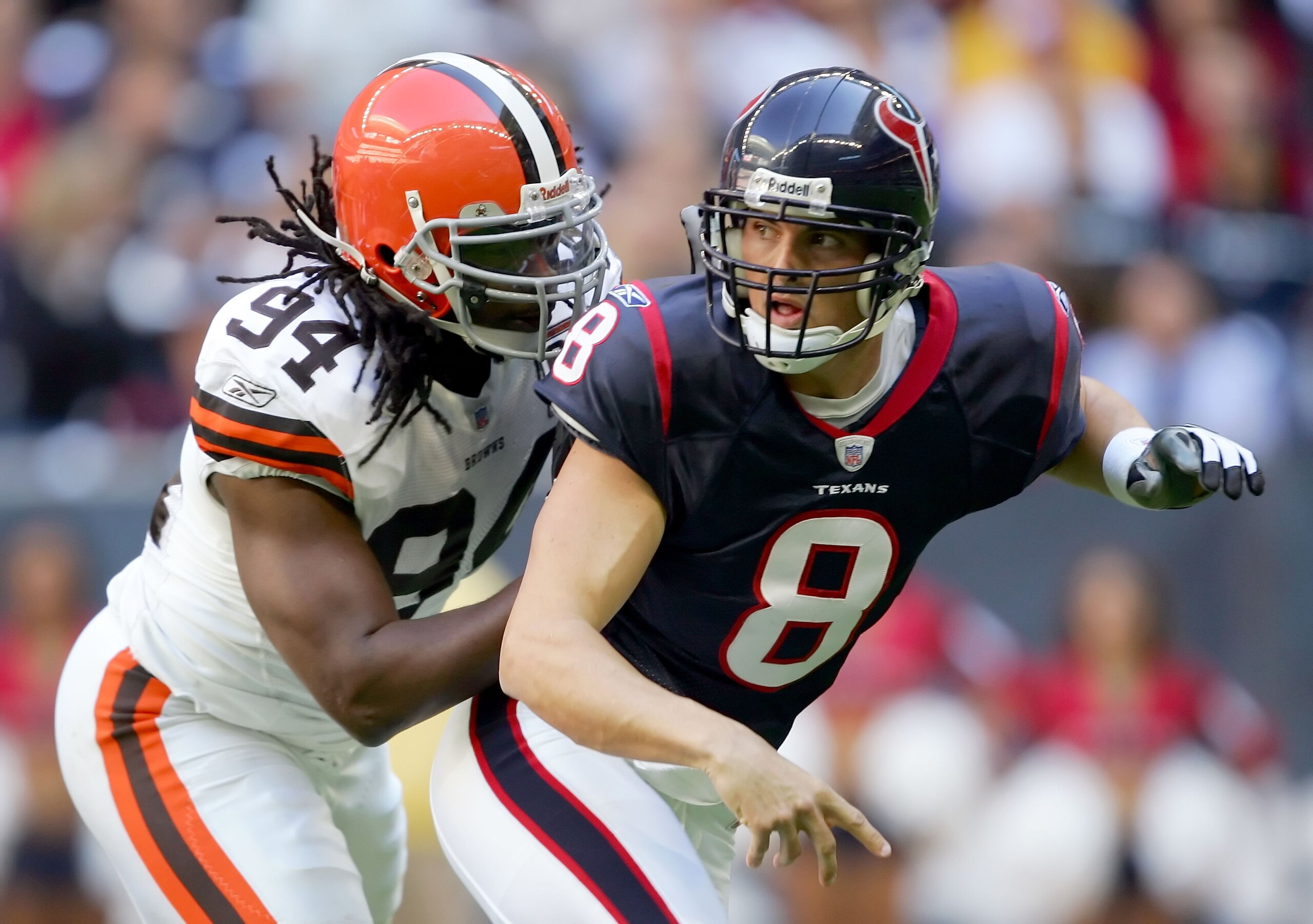 HOUSTON, TX - DECEMBER 31:  Quarterback David Carr #8 of the Houston Texans passes under pressure from Leon Williams #94 the Cleveland Browns on December 31, 2006 at Reliant Stadium in Houston, Texas. The Texans defeated the Browns 14-6.  (Photo by Lisa B