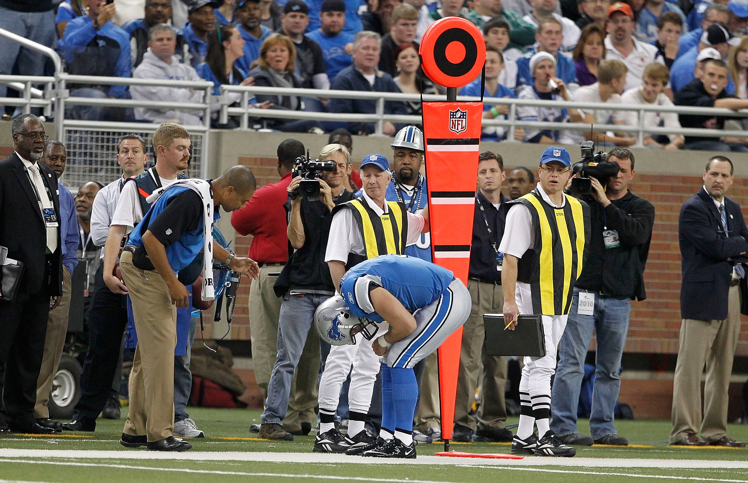 DETROIT - NOVEMBER 07:  Matthew Stafford #9 of the Detroit Lions bends over in pain against the New York Jets during the third quarter of the game at Ford Field on November 7, 2010 in Detroit, Michigan. The Jets defeated the Lions 23-20 in overtime.  (Pho