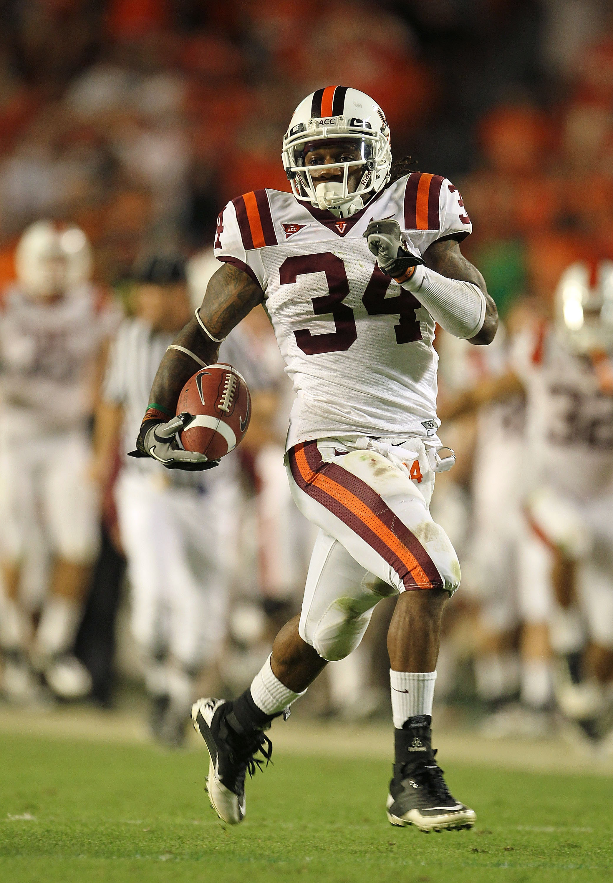 MIAMI - NOVEMBER 20:  Ryan Williams #34 of the Virginia Tech Hokies runs for a touchdown during a game against the Miami Hurricanes at Sun Life Stadium on November 20, 2010 in Miami, Florida.  (Photo by Mike Ehrmann/Getty Images)