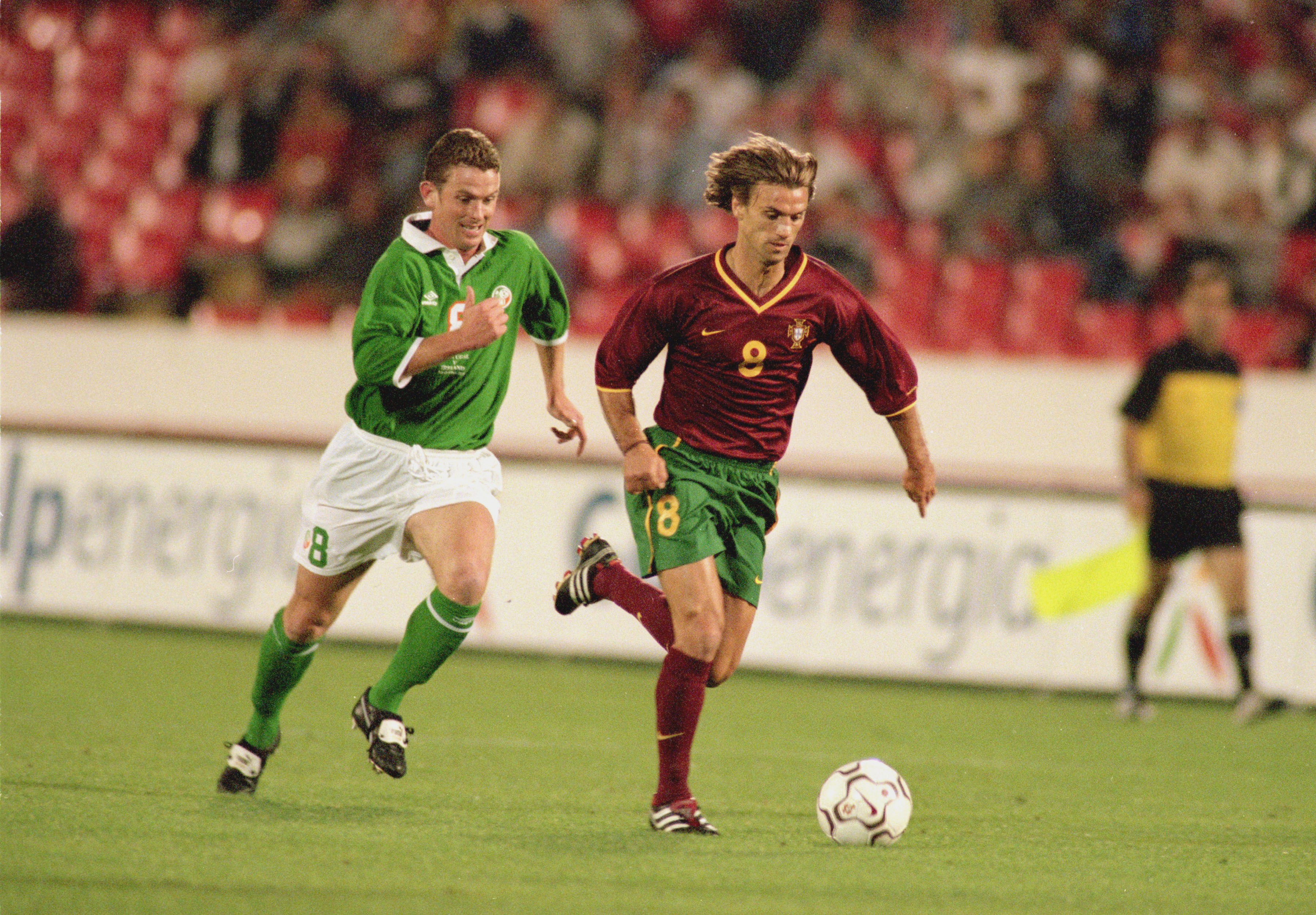 7 Oct 2000:  Joao Pinto of Portugal breezes past Mark Kinsella of Republic of Ireland during the World Cup 2002 Group 2 Qualifying match played at the Stadium of Light, in Lisbon, Portugal. The match ended in a 1-1 draw. \ Photo taken by Nuno Correia \ Ma