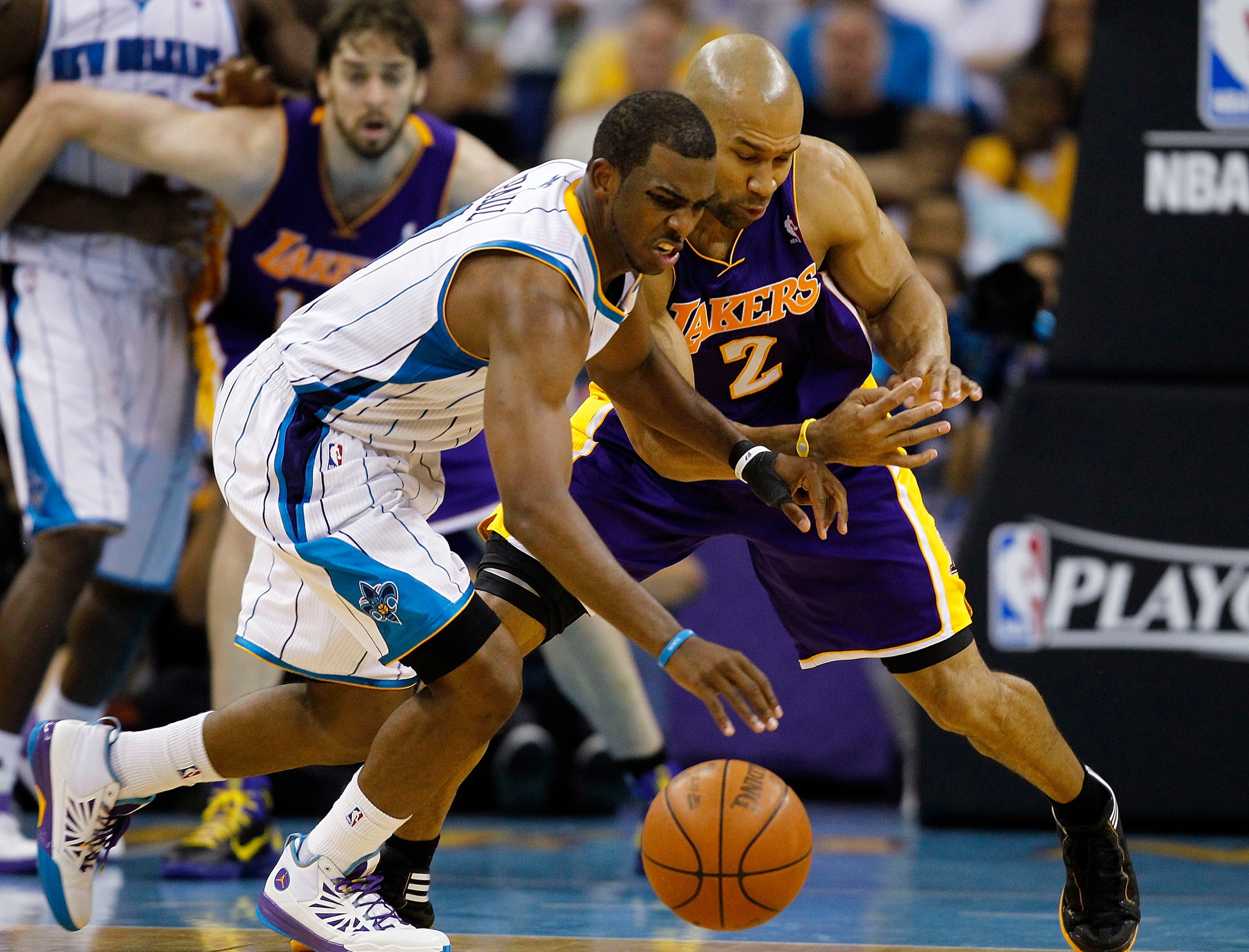NEW ORLEANS - APRIL 24: Chris Paul #3 of the New Orleans Hornets and Derek Fisher #2 of the Los Angeles Lakers scramble for a loose ball in Game Four of the Western Conference Quarterfinals in the 2011 NBA Playoffs at New Orleans Arena on April 24, 2011 NEW ORLEANS - APRIL 24: Chris Paul #3 of the New Orleans Hornets and Derek Fisher #2 of the Los Angeles Lakers scramble for a loose ball in Game Four of the Western Conference Quarterfinals in the 2011 NBA Playoffs at New Orleans Arena on April 24, 2011