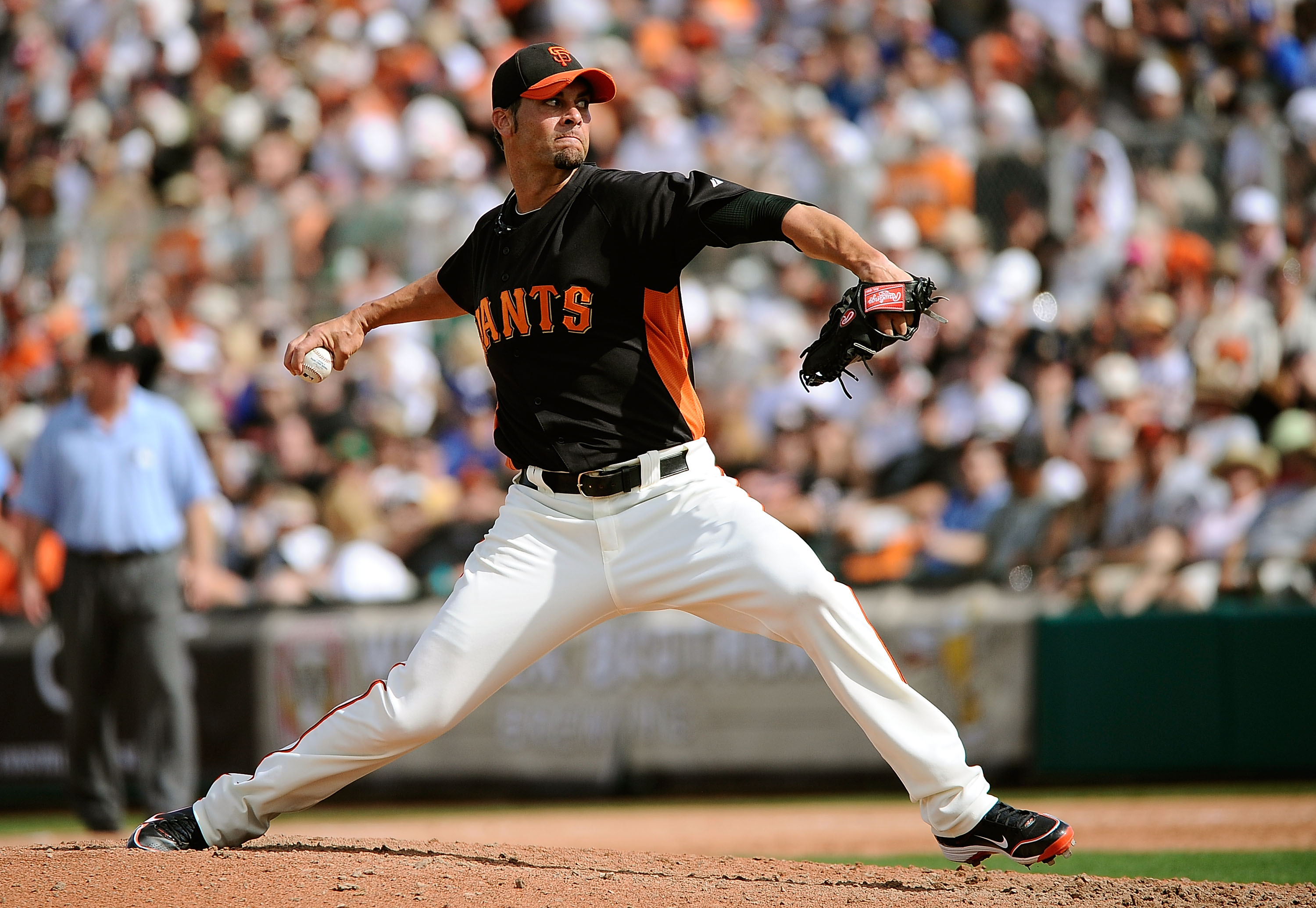 SCOTTSDALE, AZ - MARCH 18:  Ryan Vogelsong #32 of the San Francisco Giants pitches during the spring training baseball game against the Los Angeles Dodgers at Scottsdale Stadium on March 18, 2011 in Scottsdale, Arizona.  (Photo by Kevork Djansezian/Getty