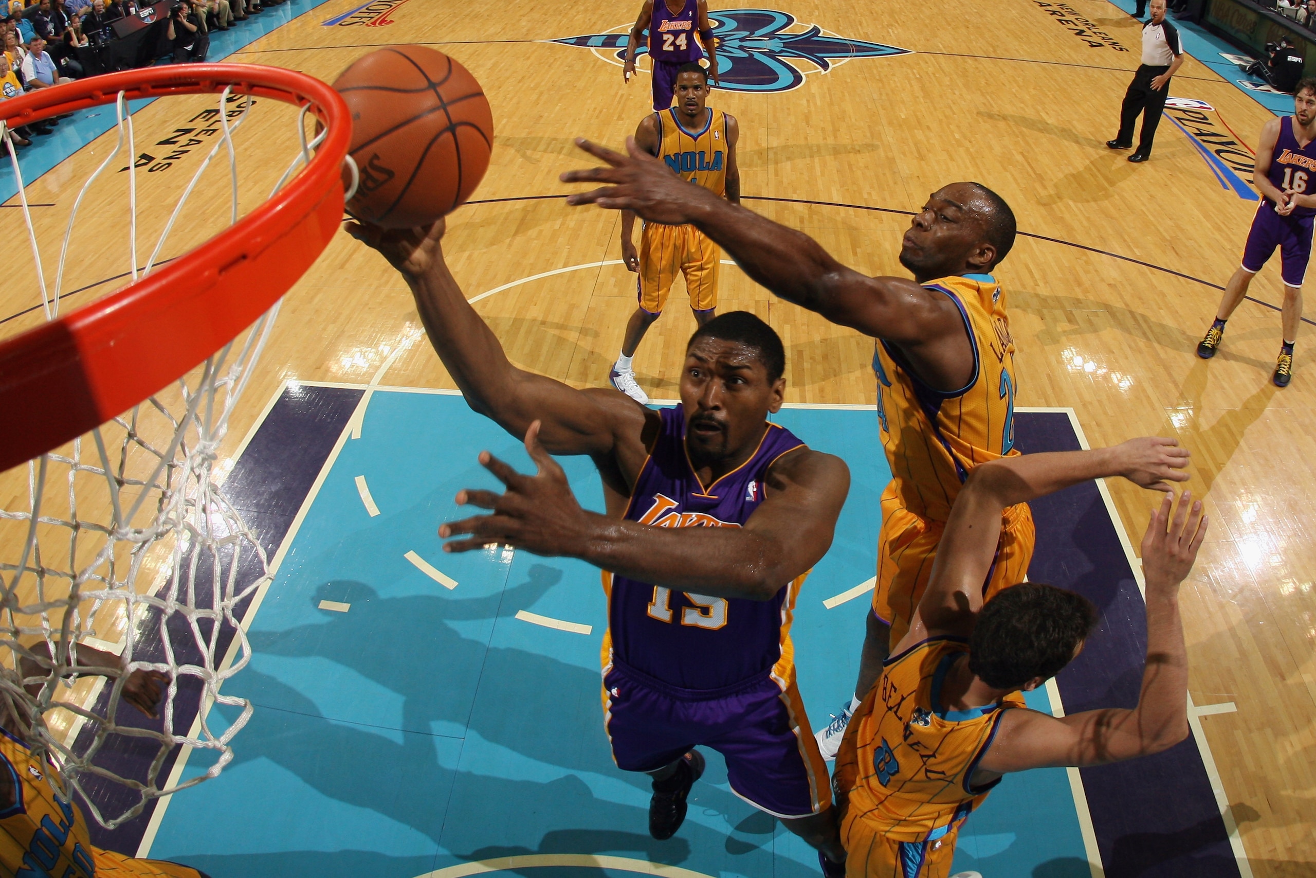 NEW ORLEANS, LA - APRIL 22: Ron Artest #15 of the Los Angeles Lakers shoots the ball over Marco Belinelli #8 of the New Orleans Hornets in Game Three of the Western Conference Quarterfinals in the 2011 NBA Playoffs at the New Orleans Arena on April 22, NEW ORLEANS, LA - APRIL 22: Ron Artest #15 of the Los Angeles Lakers shoots the ball over Marco Belinelli #8 of the New Orleans Hornets in Game Three of the Western Conference Quarterfinals in the 2011 NBA Playoffs at the New Orleans Arena on April 22,