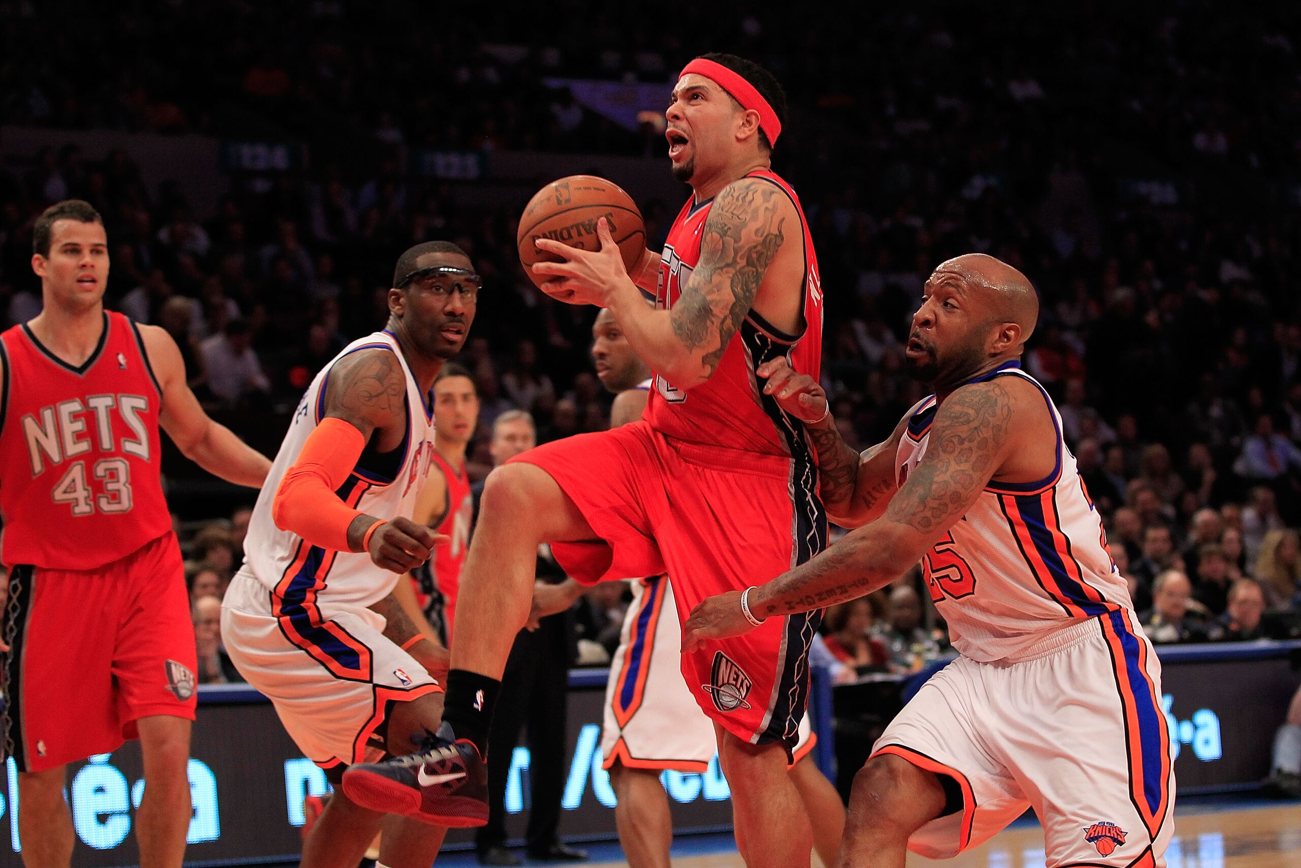 NEW YORK, NY - MARCH 30: Deron Williams #8 of the New Jersey Nets drives against Anthony Carter#25 of the New York Knicks at Madison Square Garden on March 30, 2011 in New York City. NOTE TO USER: User expressly acknowledges and agrees that, by downloadi NEW YORK, NY - MARCH 30: Deron Williams #8 of the New Jersey Nets drives against Anthony Carter#25 of the New York Knicks at Madison Square Garden on March 30, 2011 in New York City. NOTE TO USER: User expressly acknowledges and agrees that, by downloadi