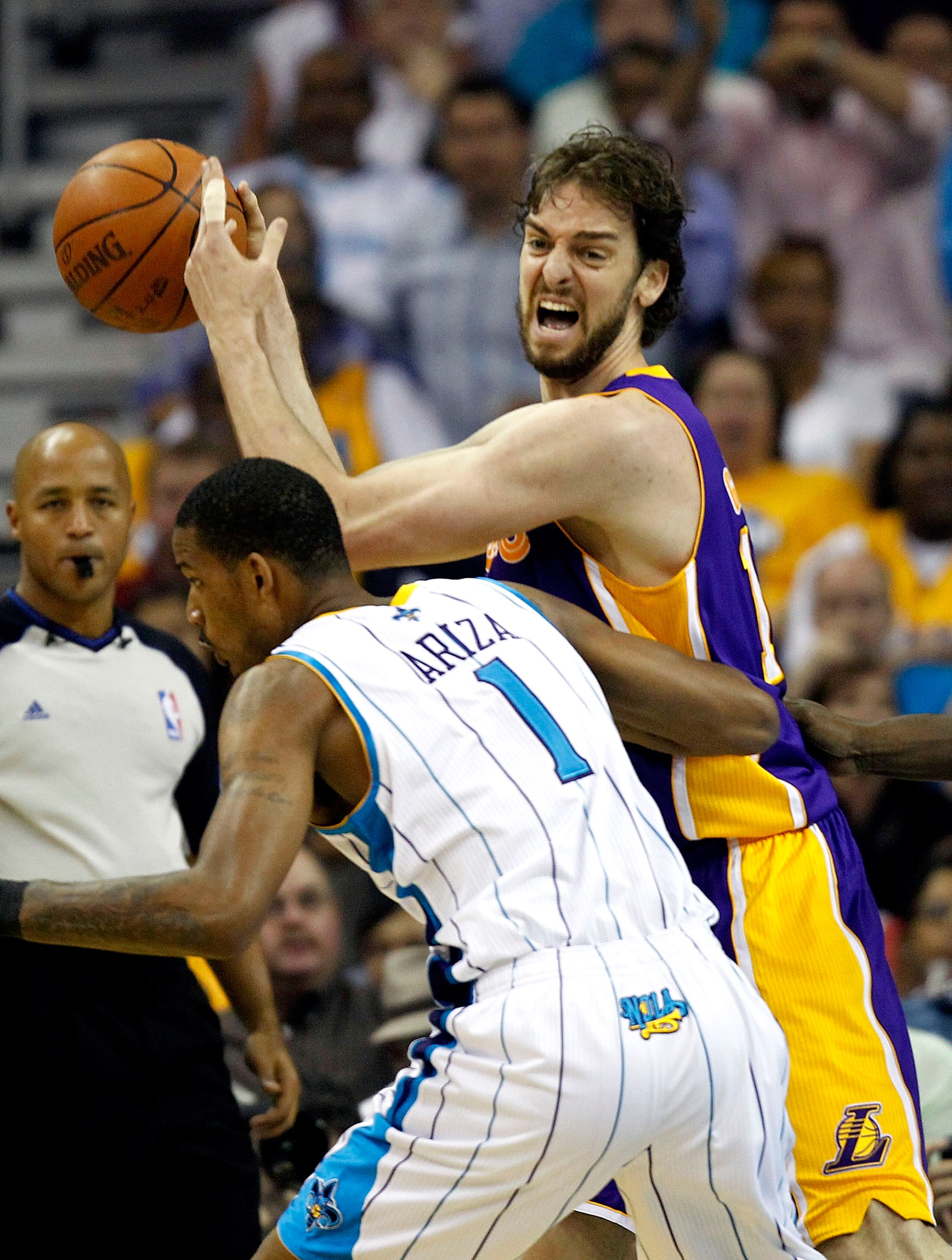 NEW ORLEANS - APRIL 24: Trevor Ariza #1 of the New Orleans Hornets guards Pau Gasol #16 of the Los Angeles Lakers in Game Four of the Western Conference Quarterfinals in the 2011 NBA Playoffs at New Orleans Arena on April 24, 2011 in New Orleans, Louisia NEW ORLEANS - APRIL 24: Trevor Ariza #1 of the New Orleans Hornets guards Pau Gasol #16 of the Los Angeles Lakers in Game Four of the Western Conference Quarterfinals in the 2011 NBA Playoffs at New Orleans Arena on April 24, 2011 in New Orleans, Louisia