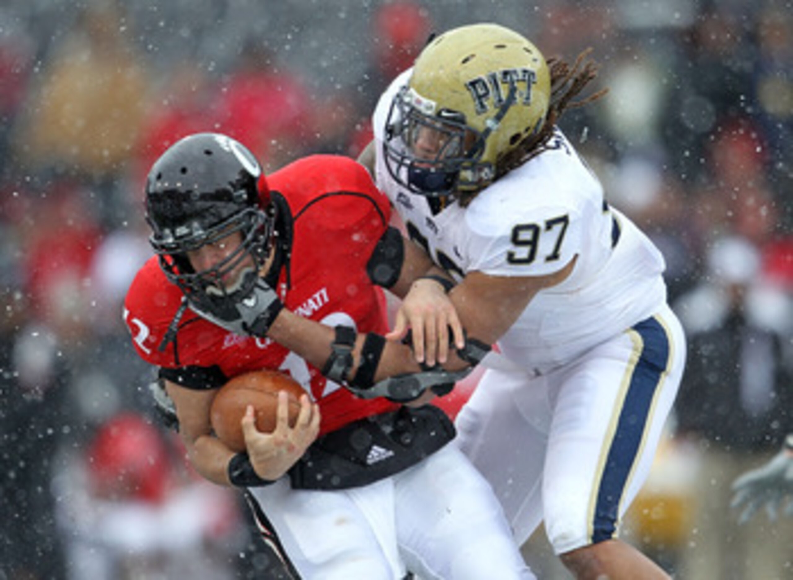 CINCINNATI, OH - DECEMBER 04: Jabaal Sheard #97 of the Pittsburgh Panthers tackles Zach Collaros #12 of the Cincinnati Bearcats during the Big East Conference game against at Nippert Stadium on December 4, 2010 in Cincinnati, Ohio. Pittsburgh won 28-10. CINCINNATI, OH - DECEMBER 04: Jabaal Sheard #97 of the Pittsburgh Panthers tackles Zach Collaros #12 of the Cincinnati Bearcats during the Big East Conference game against at Nippert Stadium on December 4, 2010 in Cincinnati, Ohio. Pittsburgh won 28-10.