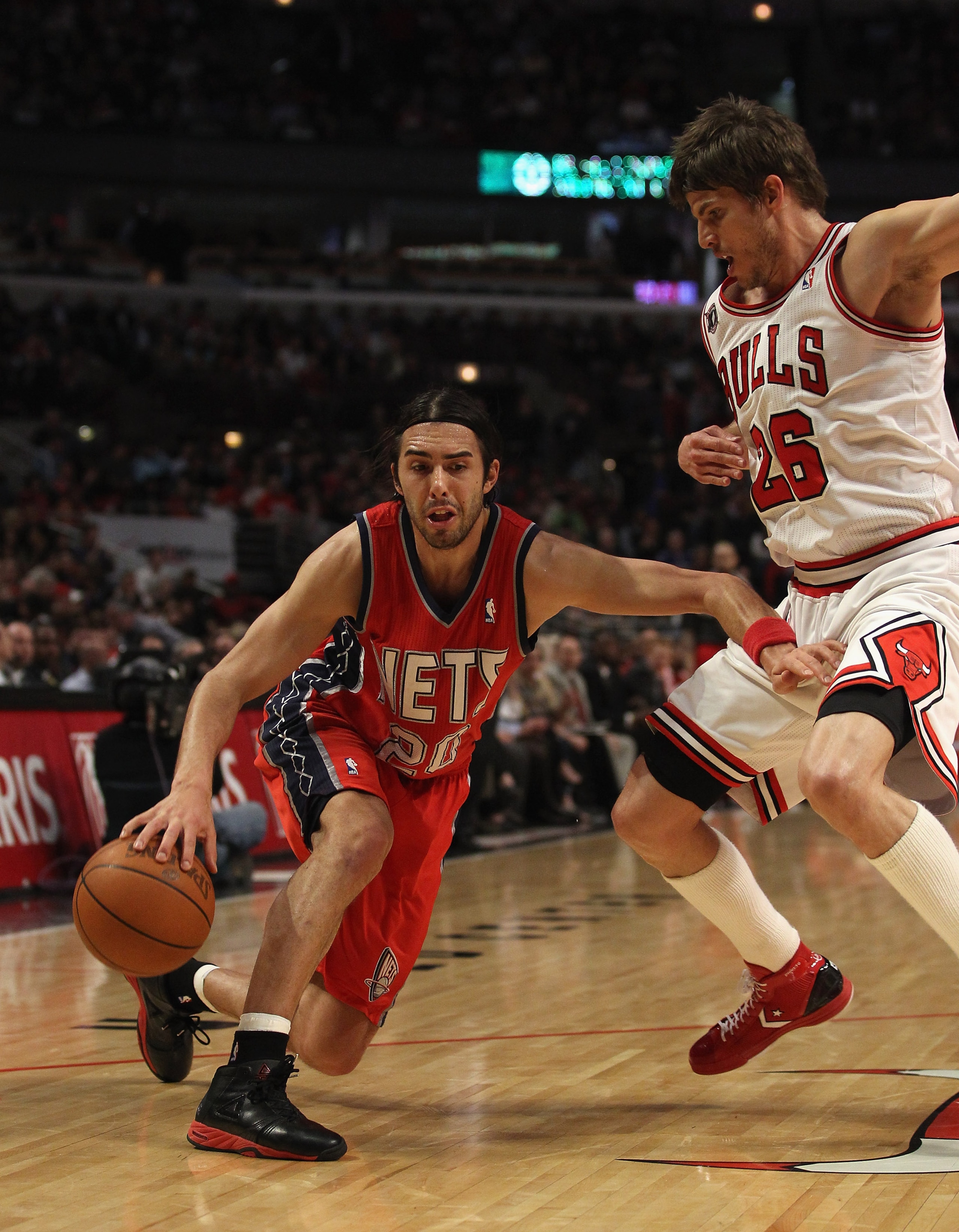 CHICAGO, IL - APRIL 13: Sasha Vujacic #20 of the New Jersey Nets moves against Kyle Korver #26 of the Chicago Bulls at the United Center on April 13, 2011 in Chicago, Illinois. The Bulls defeated the Nets 97-92. NOTE TO USER: User expressly acknowledges a CHICAGO, IL - APRIL 13: Sasha Vujacic #20 of the New Jersey Nets moves against Kyle Korver #26 of the Chicago Bulls at the United Center on April 13, 2011 in Chicago, Illinois. The Bulls defeated the Nets 97-92. NOTE TO USER: User expressly acknowledges a