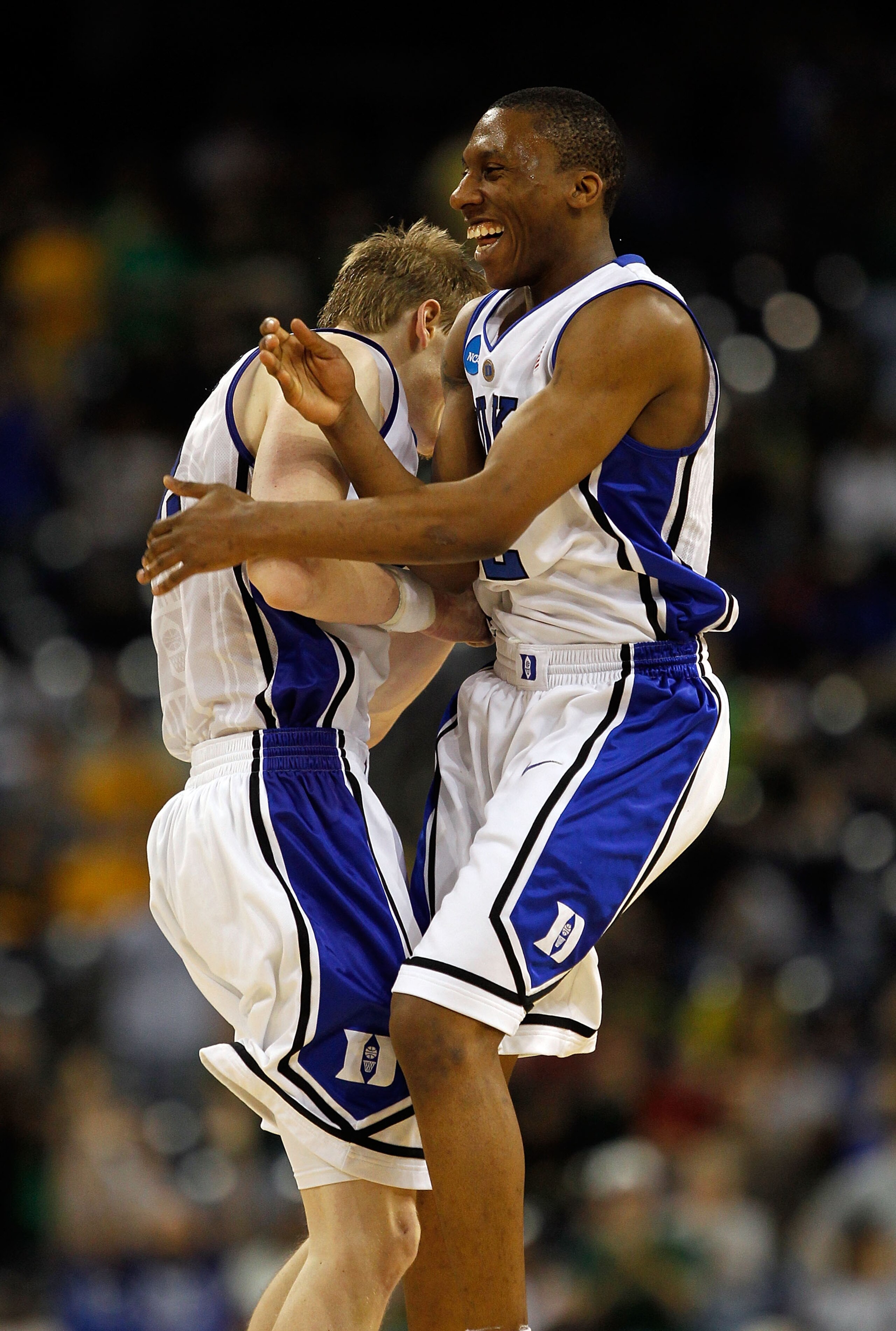 HOUSTON - MARCH 28: Nolan Smith #2 (R) and Kyle Singler #12 of the Duke Dlue Devils celebrate a win over the Baylor Bears during the south regional final of the 2010 NCAA men's basketball tournament at Reliant Stadium on March 28, 2010 in Houston, Texas. HOUSTON - MARCH 28: Nolan Smith #2 (R) and Kyle Singler #12 of the Duke Dlue Devils celebrate a win over the Baylor Bears during the south regional final of the 2010 NCAA men's basketball tournament at Reliant Stadium on March 28, 2010 in Houston, Texas.