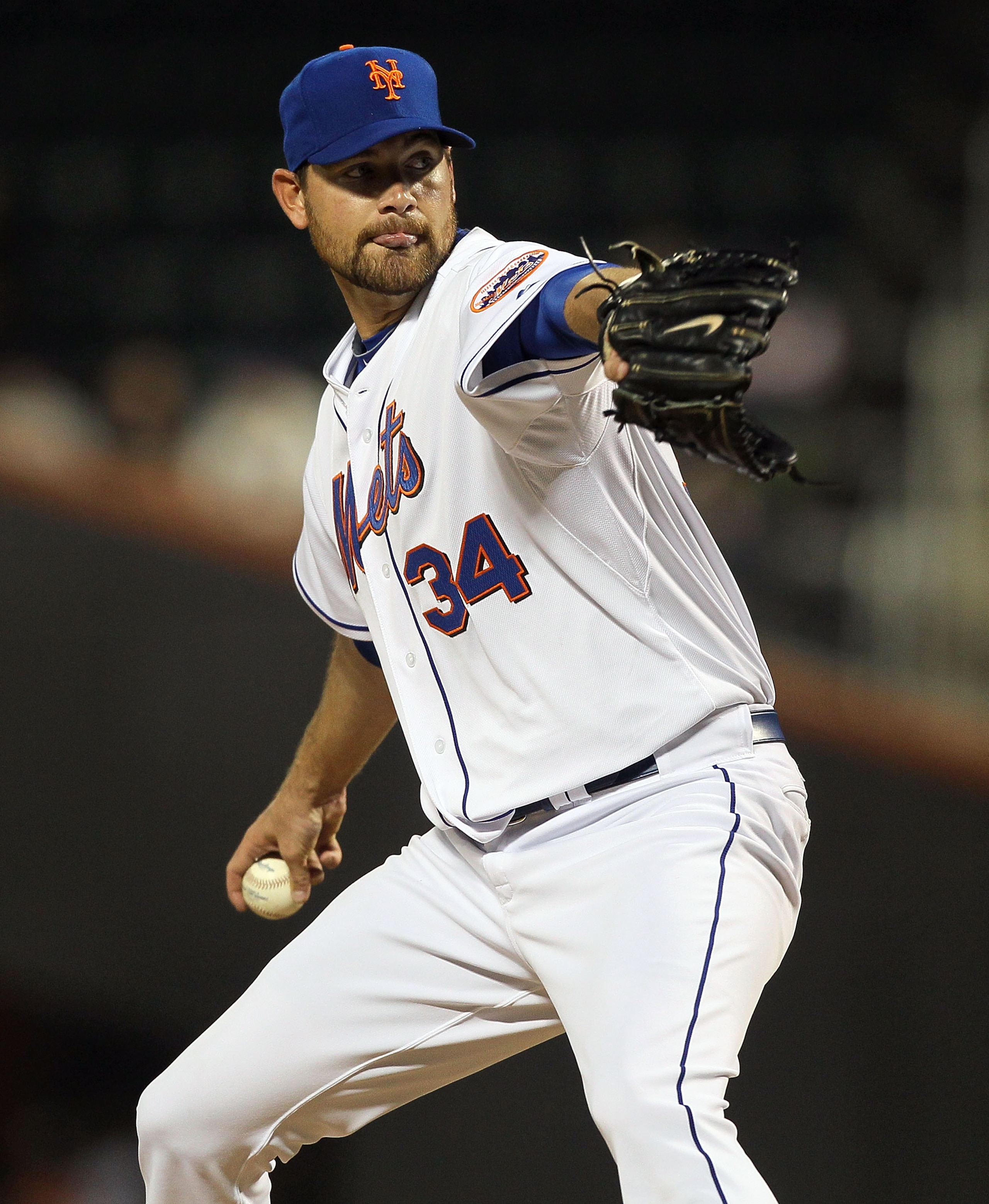 NEW YORK, NY - APRIL 11:  Mike Pelfrey #34 of the New York Mets deals a pitch against the Colorado Rockies on April 11, 2011 at Citi Field in the Flushing neighborhood of the Queens borough of New York City.  (Photo by Jim McIsaac/Getty Images)