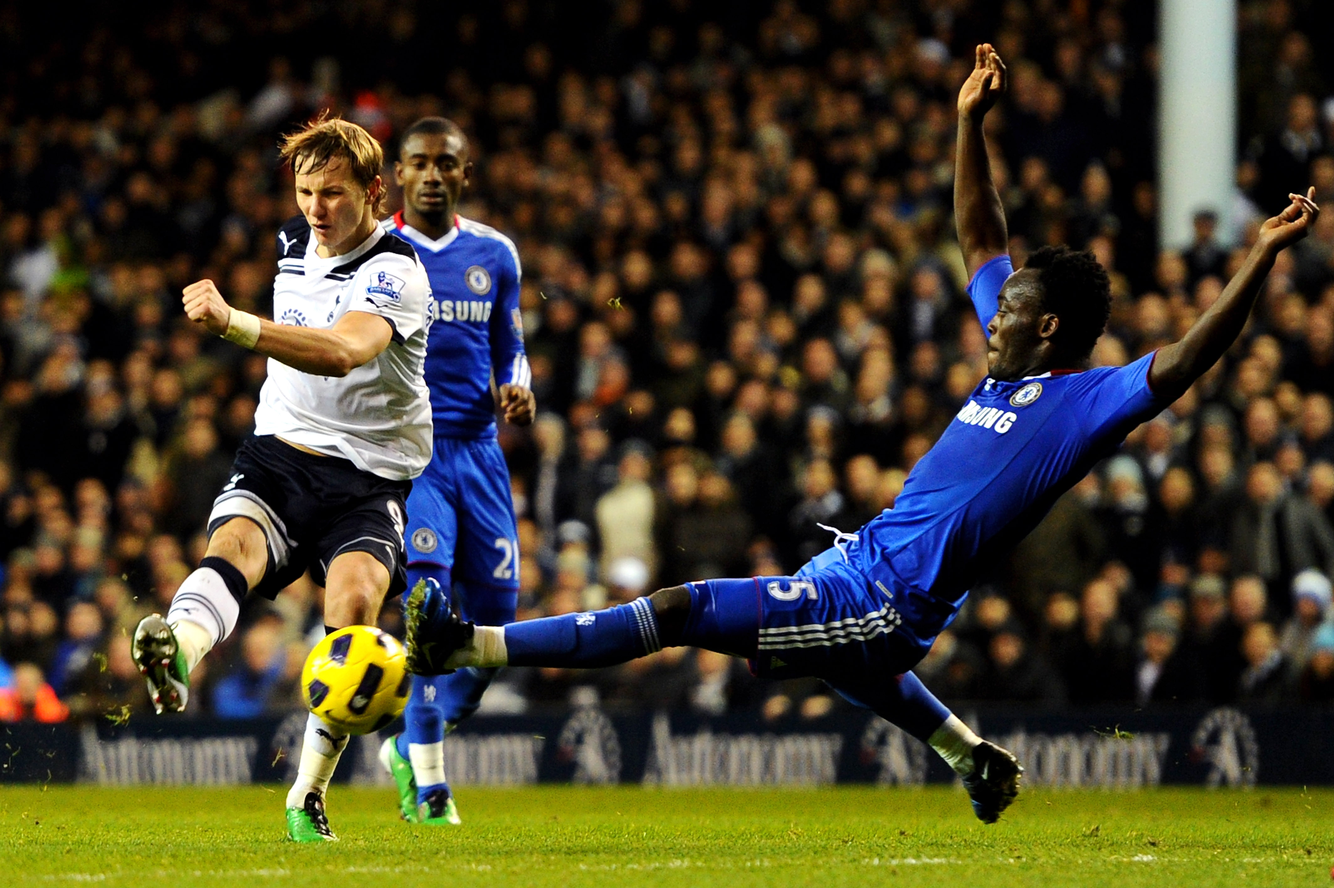 LONDON, ENGLAND - DECEMBER 12: Roman Pavlyuchenko of Spurs has his shot on goal blocked by Michael Essien of Chelsea during the Barclays Premier League match between Tottenham Hotspur and Chelsea at White Hart Lane on December 12, 2010 in London, England.