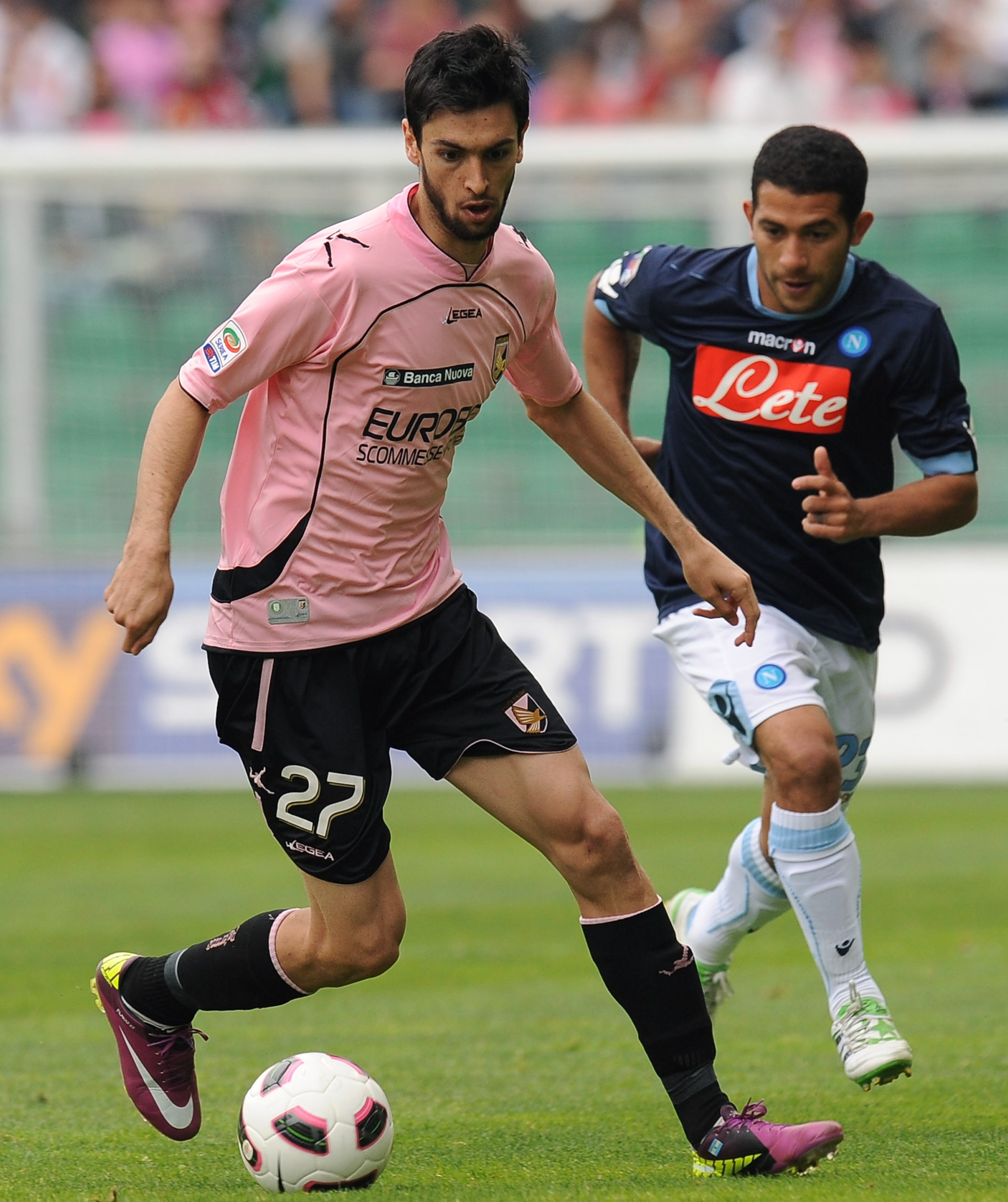 PALERMO, ITALY - APRIL 23:  Javier Pastore (L) of Palermo holds off the challenge from Walter Gargano of Napoli during the Serie A match between US Citta di Palermo and SSC Napoli at Stadio Renzo Barbera on April 23, 2011 in Palermo, Italy.  (Photo by Tul