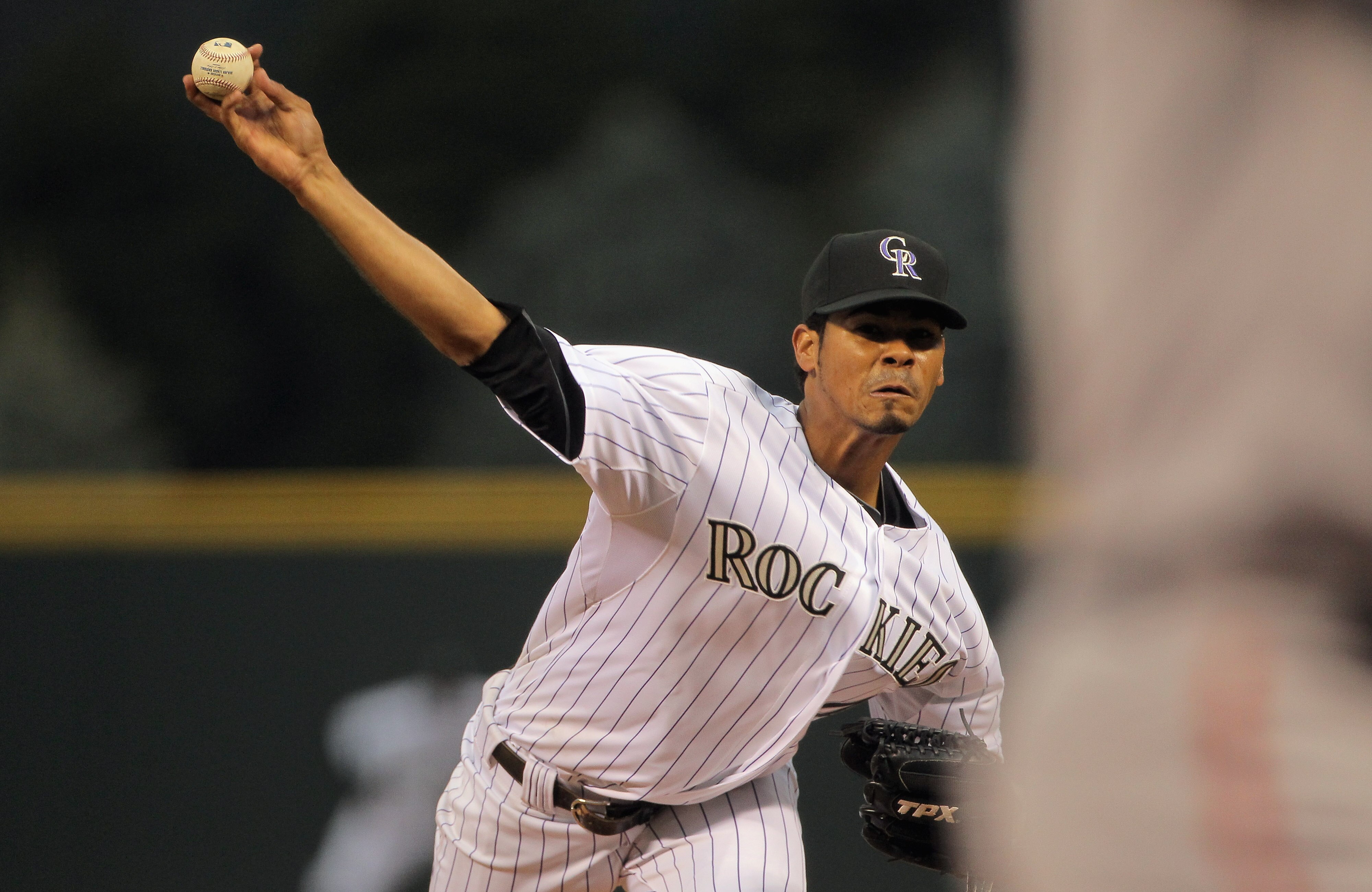 DENVER, CO - APRIL 18:  Starting pitcher Esmil Rogers #48 of the Colorado Rockies delivers against the San Francisco Giants at Coors Field on April 18, 2011 in Denver, Colorado. Rogers collected the loss as the Giants defeated the Rockies 8-1.  (Photo by