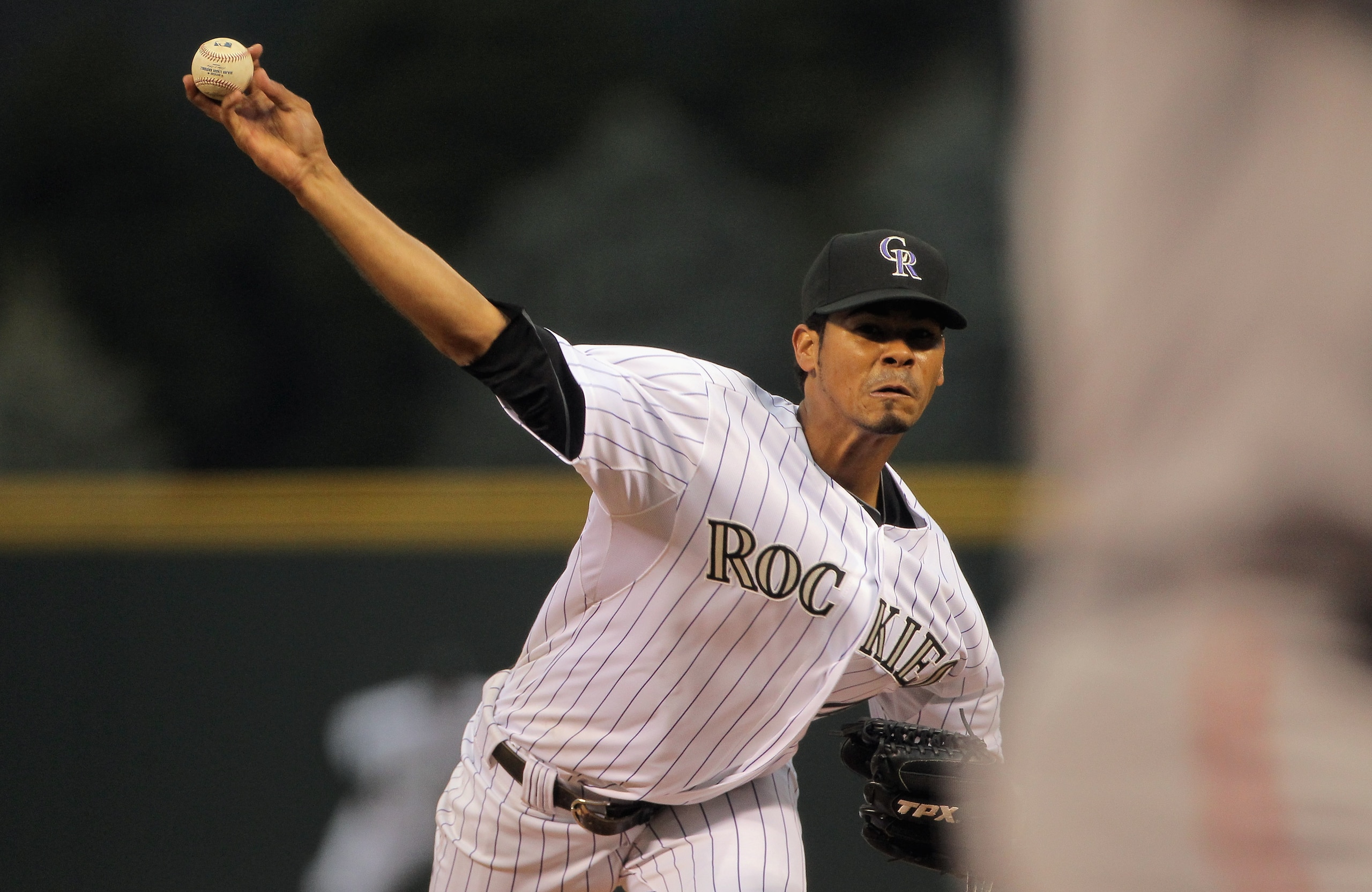 DENVER, CO - APRIL 18: Starting pitcher Esmil Rogers #48 of the Colorado Rockies delivers against the San Francisco Giants at Coors Field on April 18, 2011 in Denver, Colorado. Rogers collected the loss as the Giants defeated the Rockies 8-1. (Photo by DENVER, CO - APRIL 18: Starting pitcher Esmil Rogers #48 of the Colorado Rockies delivers against the San Francisco Giants at Coors Field on April 18, 2011 in Denver, Colorado. Rogers collected the loss as the Giants defeated the Rockies 8-1. (Photo by
