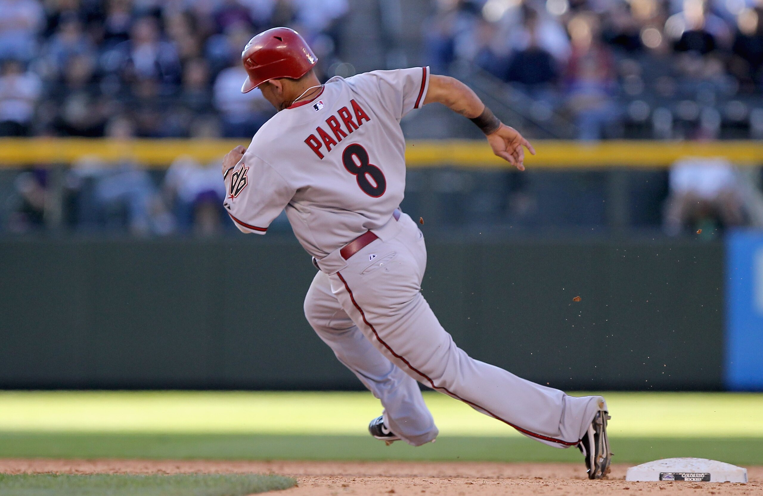 DENVER, CO - APRIL 01: Gerardo Parra #8 of the Arizona Diamondbacks rounds second base against the Colorado Rockies during Opening Day at Coors Field on April 1, 2011 in Denver, Colorado. The Diamondbacks defeated the Rockies 7-6 in 11 innings. (Photo b DENVER, CO - APRIL 01: Gerardo Parra #8 of the Arizona Diamondbacks rounds second base against the Colorado Rockies during Opening Day at Coors Field on April 1, 2011 in Denver, Colorado. The Diamondbacks defeated the Rockies 7-6 in 11 innings. (Photo b
