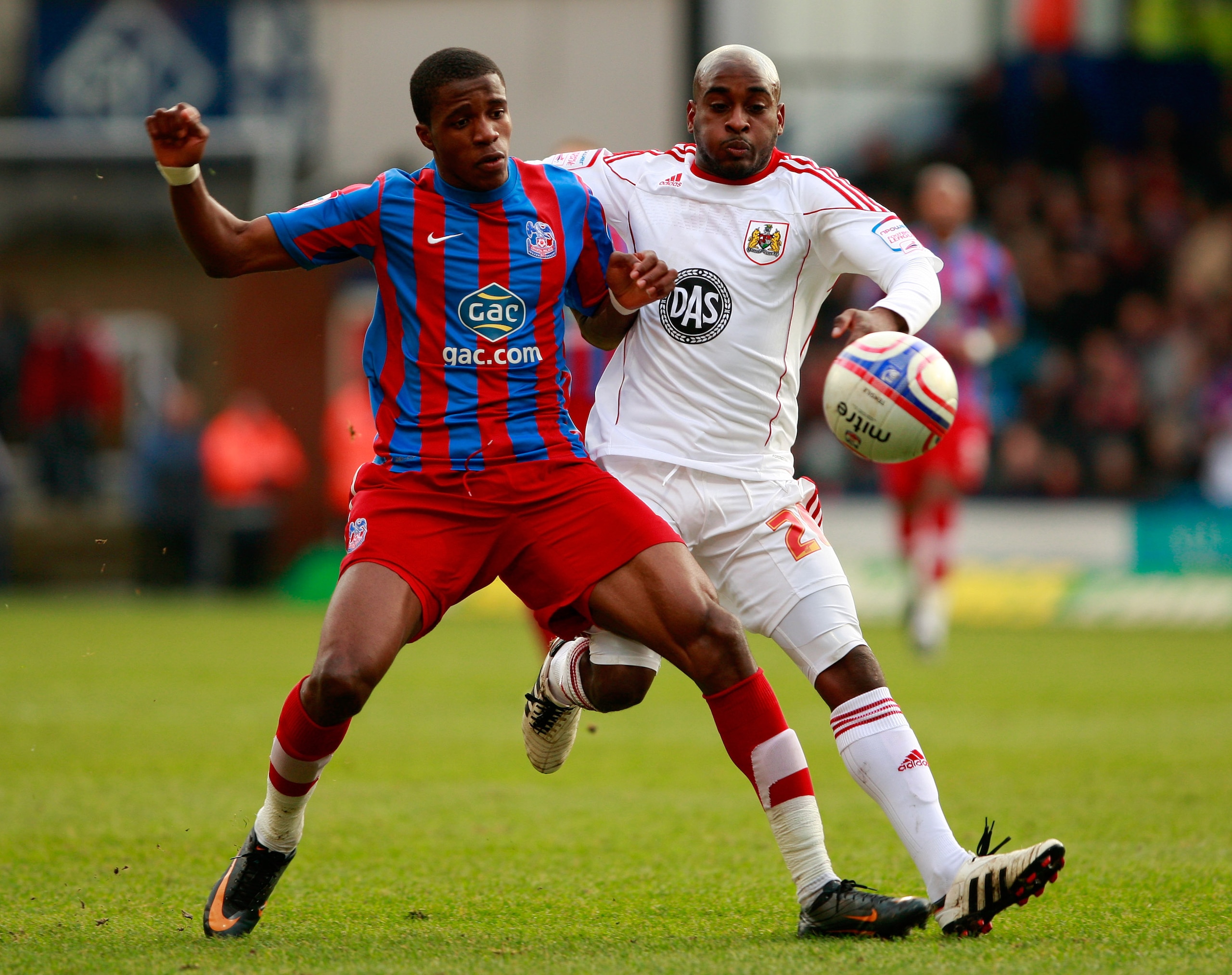 LONDON, ENGLAND - JANUARY 22:  Wilfried Zaha (L) of Crystal Palace battles for the ball against Jamal Campbell-Ryce of Bristol City during the npower Championship match between Crystal Palace and Bristol City at Selhurst Park on January 22, 2011 in London