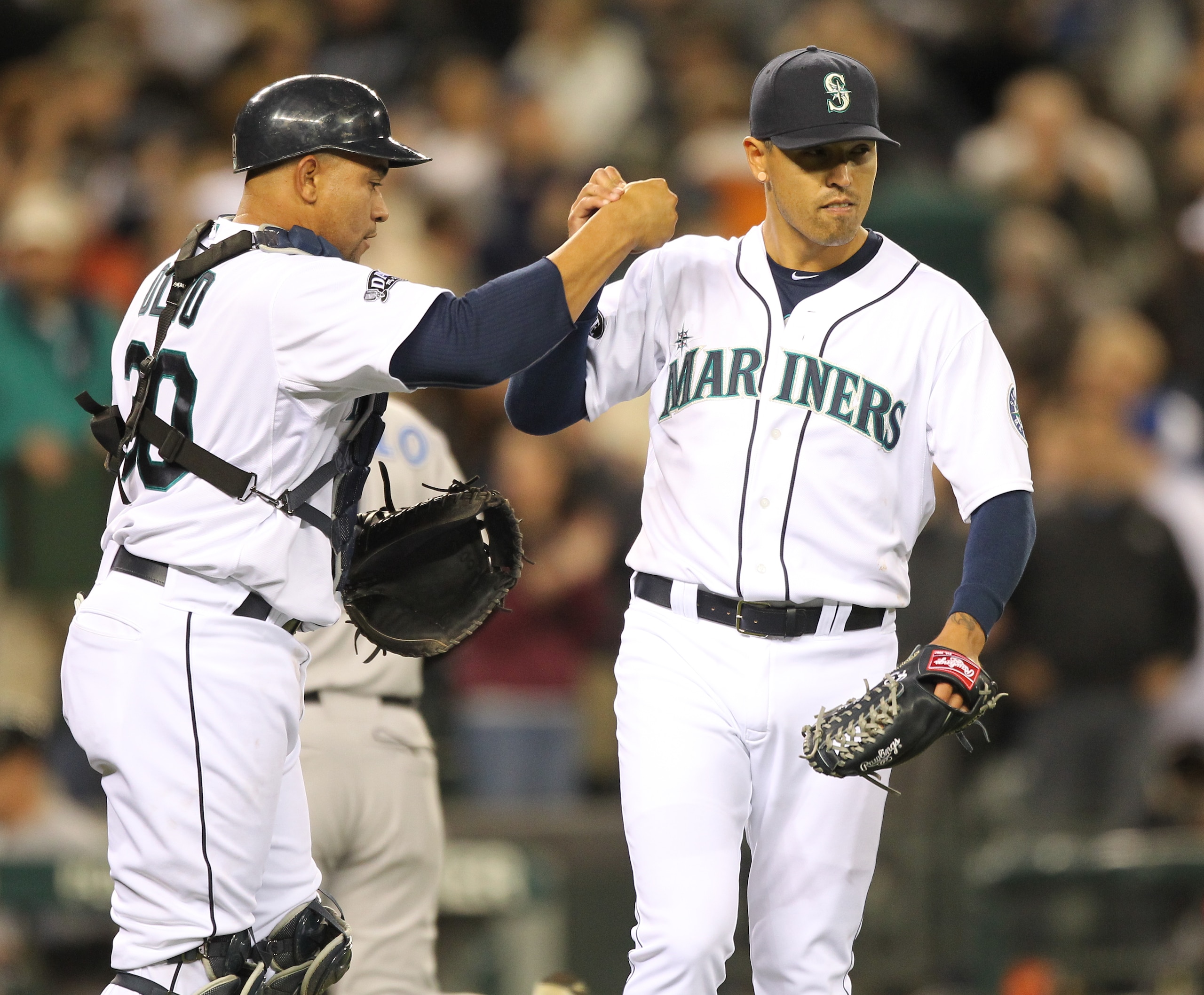 SEATTLE, WA - APRIL 12:  Catcher Miguel Olivo #30 of the Seattle Mariners celebrates with relief pitcher Brandon League #43 after defeating the Toronto Blue Jays 3-2 at Safeco Field on April 12, 2011 in Seattle, Washington. (Photo by Otto Greule Jr/Getty