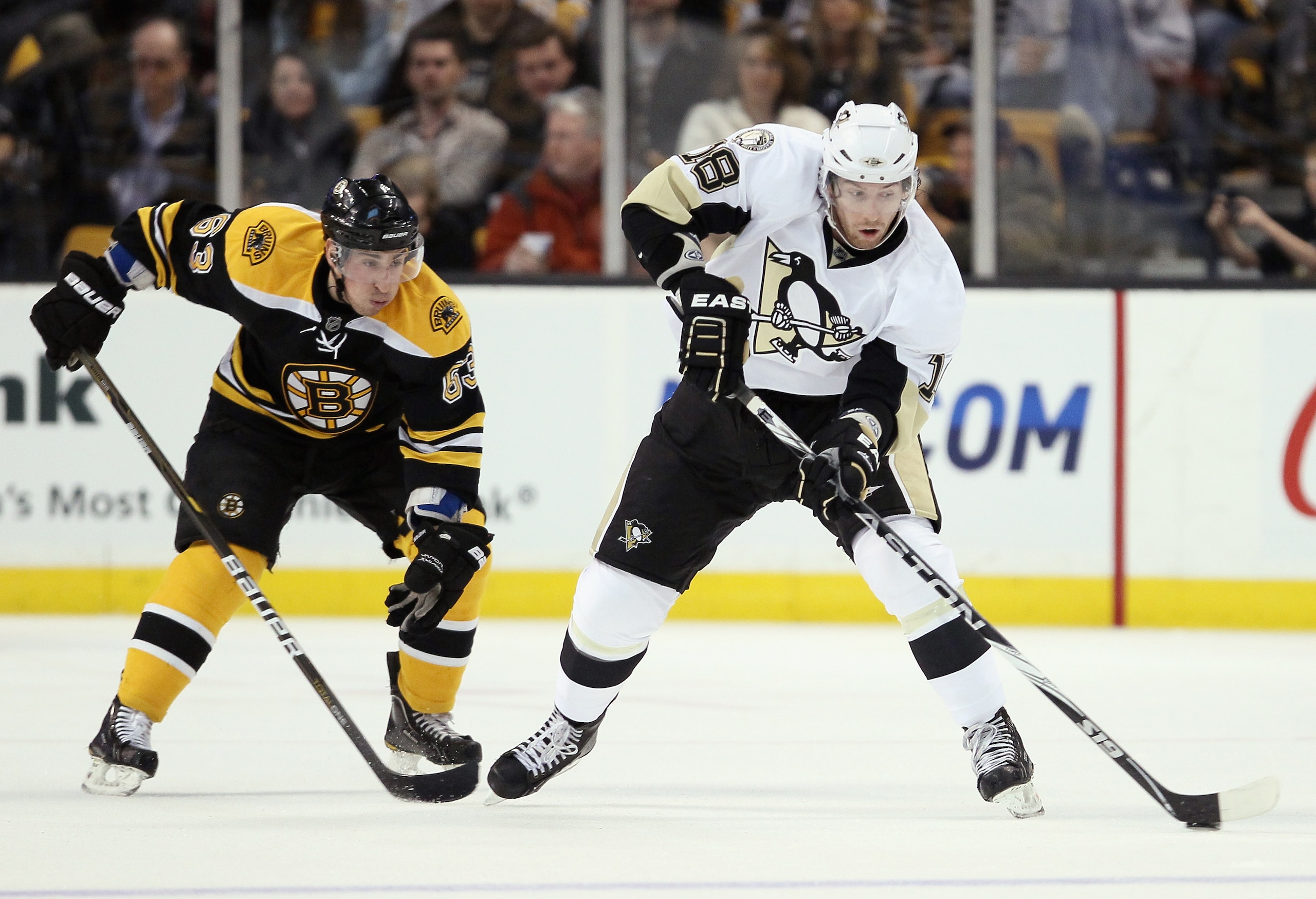 BOSTON, MA - MARCH 05: James Neal #18 of the Pittsburgh Penguins takes the puck as Brad Marchand #63 of the Boston Bruins defends on March 5, 2011 at the TD Garden in Boston, Massachusetts.  (Photo by Elsa/Getty Images)
