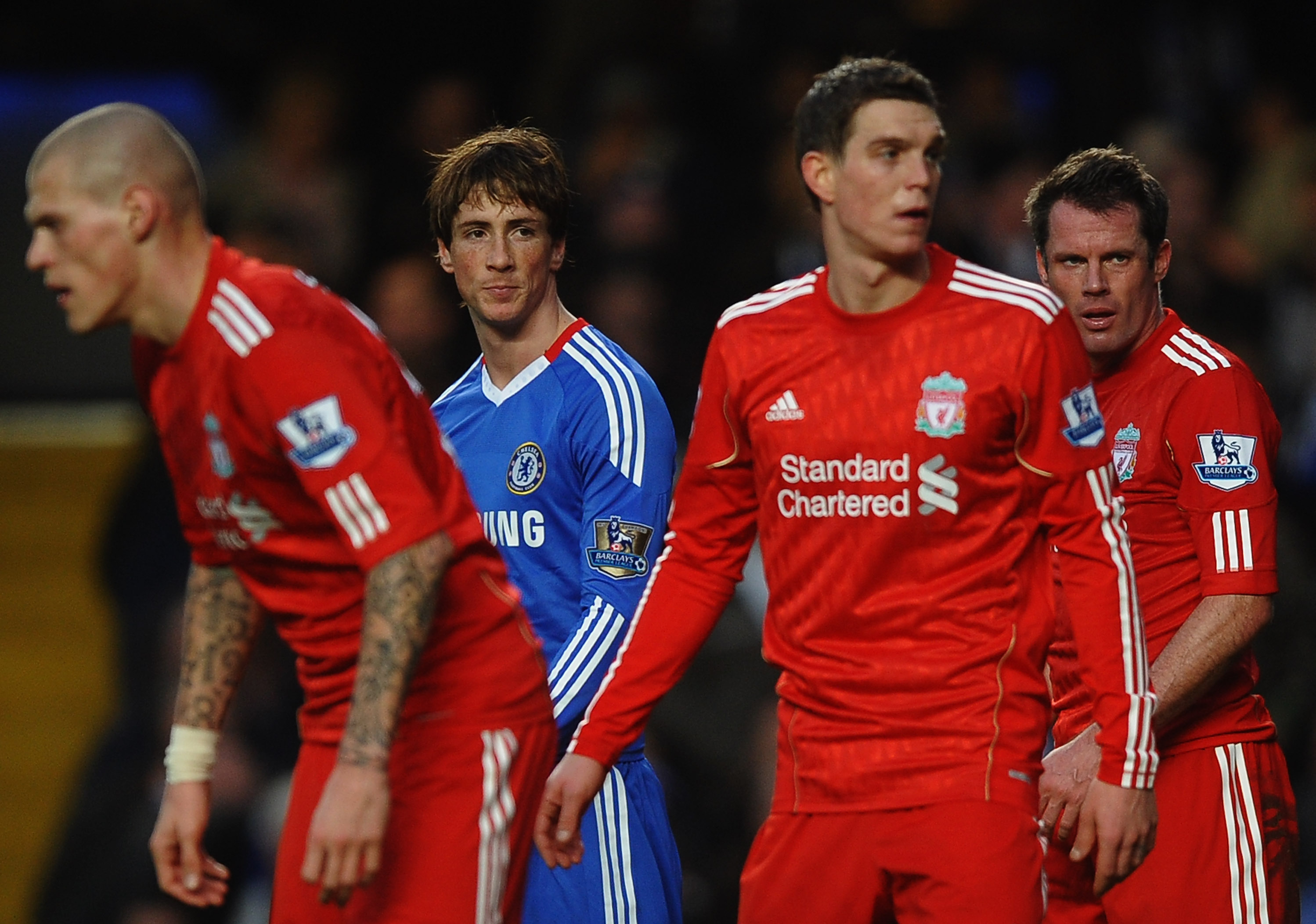 LONDON, ENGLAND - FEBRUARY 06:  Fernando Torres of Chelsea looks across a Liverpool defenders Martin Skrtel (L), Daniel Agger (2R) and Jamie Carragher )R) during the Barclays Premier League match between Chelsea and Liverpool at Stamford Bridge on Februar