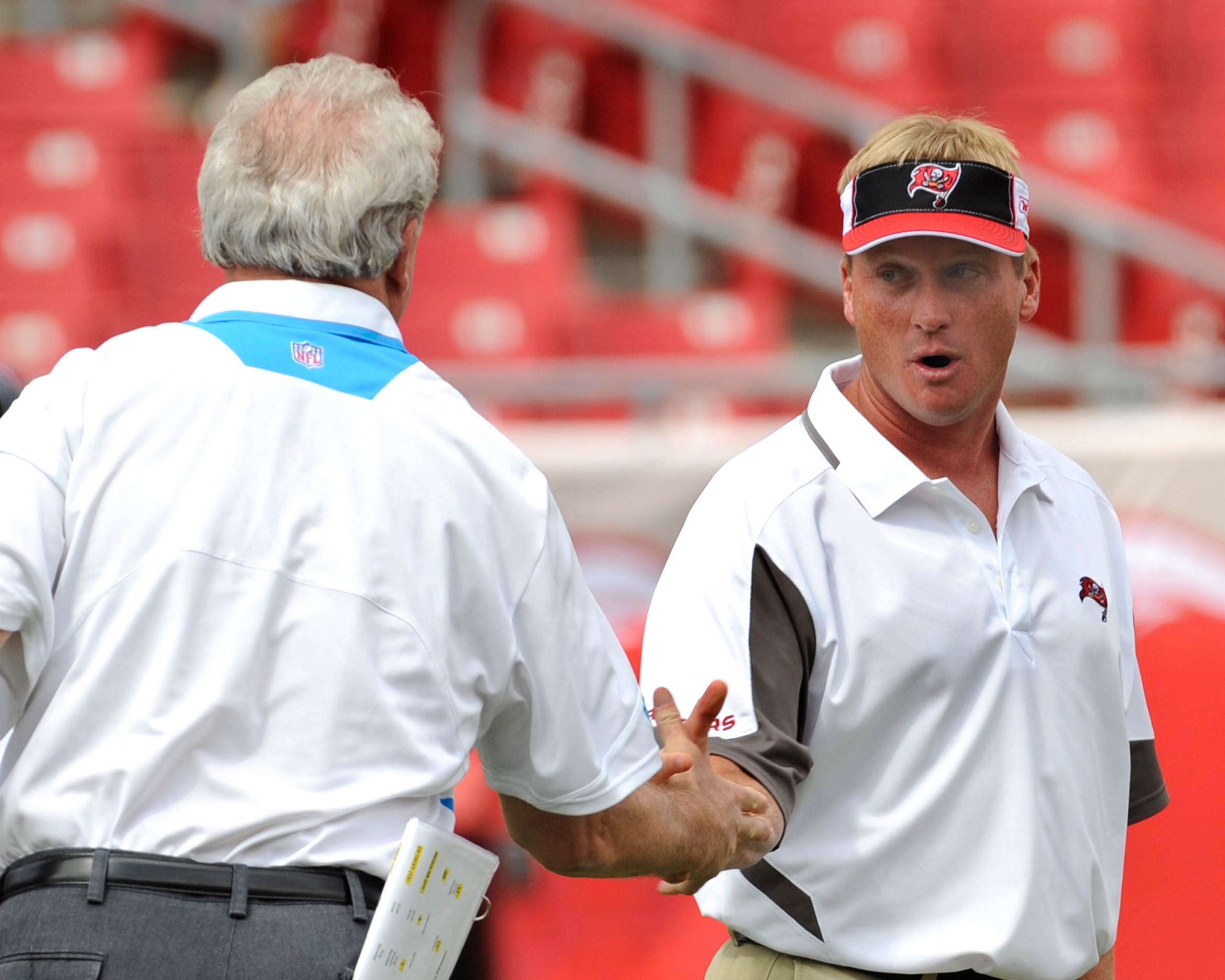 TAMPA, FL - OCTOBER 12: Coach Jon Gruden of the Tampa Bay Buccaneers shakes hands with coach John Fox of the Carolina Panthers at Raymond James Stadium on October 12, 2008 in Tampa, Florida.  (Photo by Al Messerschmidt/Getty Images)