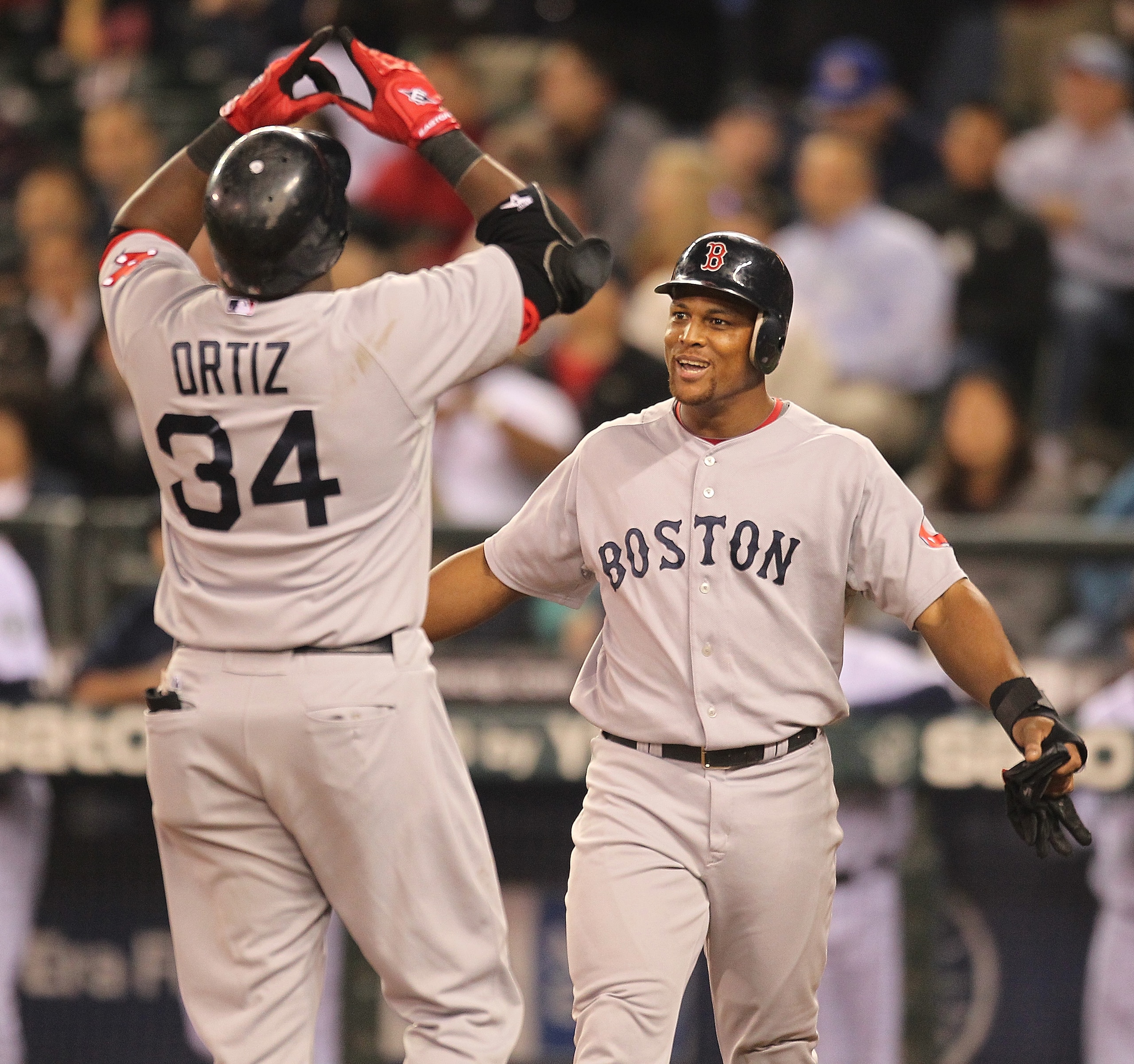 SEATTLE - SEPTEMBER 14:  David Ortiz #34 of the Boston Red Sox is greeted at home plate by Adrian Beltre #29 after hitting a three-run home run against the Seattle Mariners at Safeco Field on September 14, 2010 in Seattle, Washington. (Photo by Otto Greul