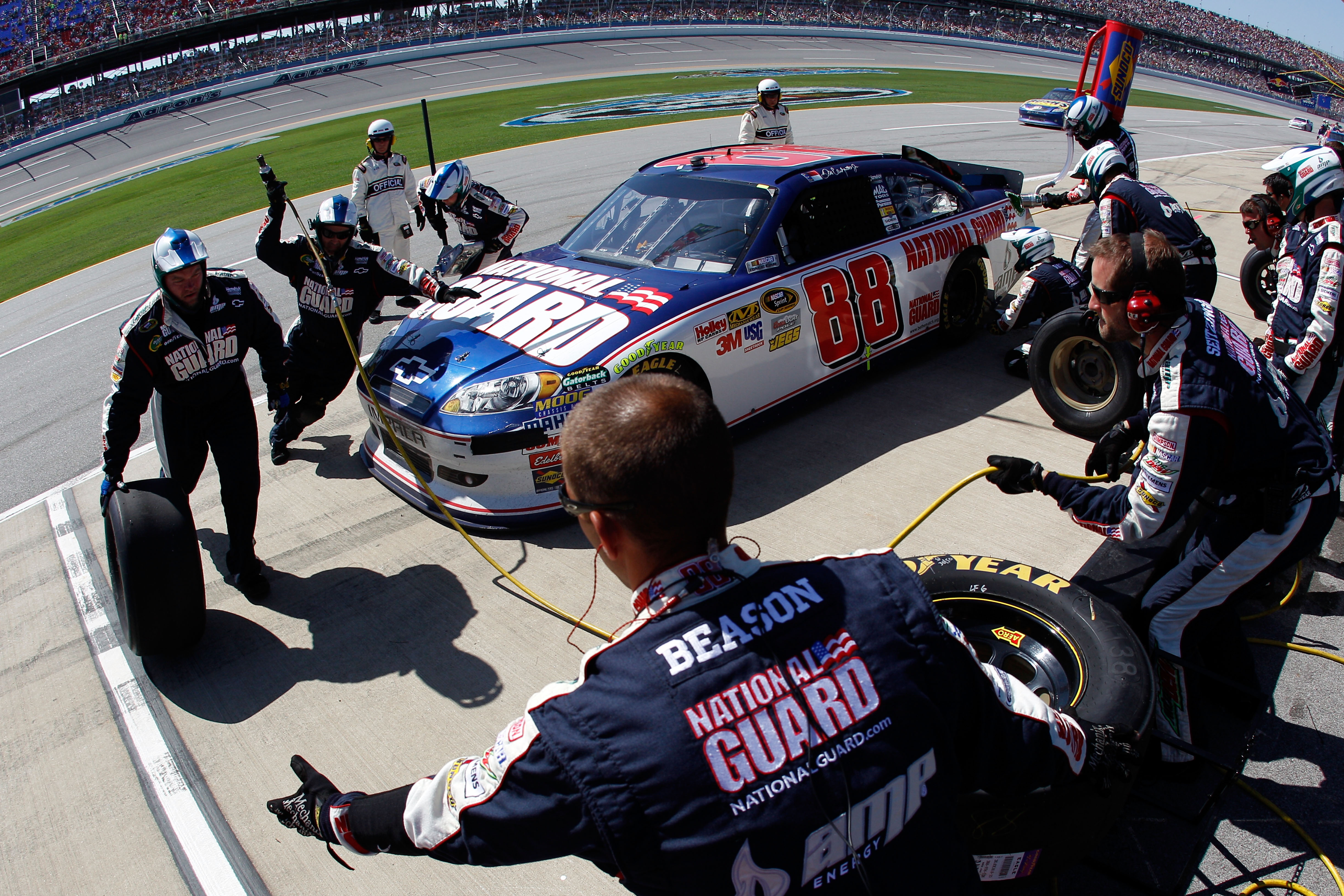 TALLADEGA, AL - APRIL 17:  Dale Earnhardt Jr., driver of the #88 National Guard/AMP Energy Chevrolet, comes in for a pit stop during the NASCAR Sprint Cup Series Aaron's 499 at Talladega Superspeedway on April 17, 2011 in Talladega, Alabama.  (Photo by Ch