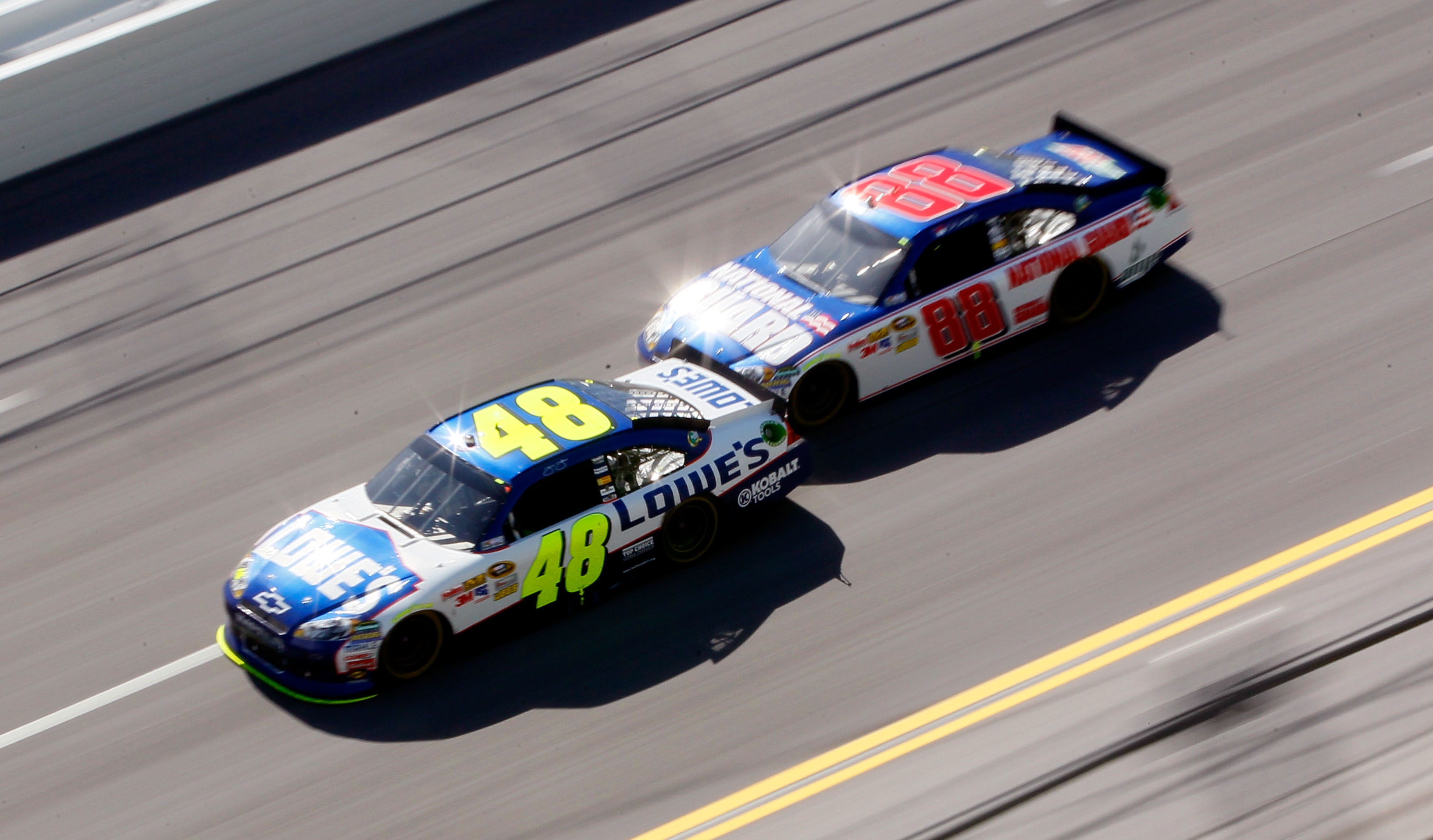 TALLADEGA, AL - APRIL 17:  Jimmie Johnson, driver of the #48 Lowe's Chevrolet, leads Dale Earnhardt Jr., driver of the #88 National Guard/AMP Energy Chevrolet, during the NASCAR Sprint Cup Series Aaron's 499 at Talladega Superspeedway on April 17, 2011 in