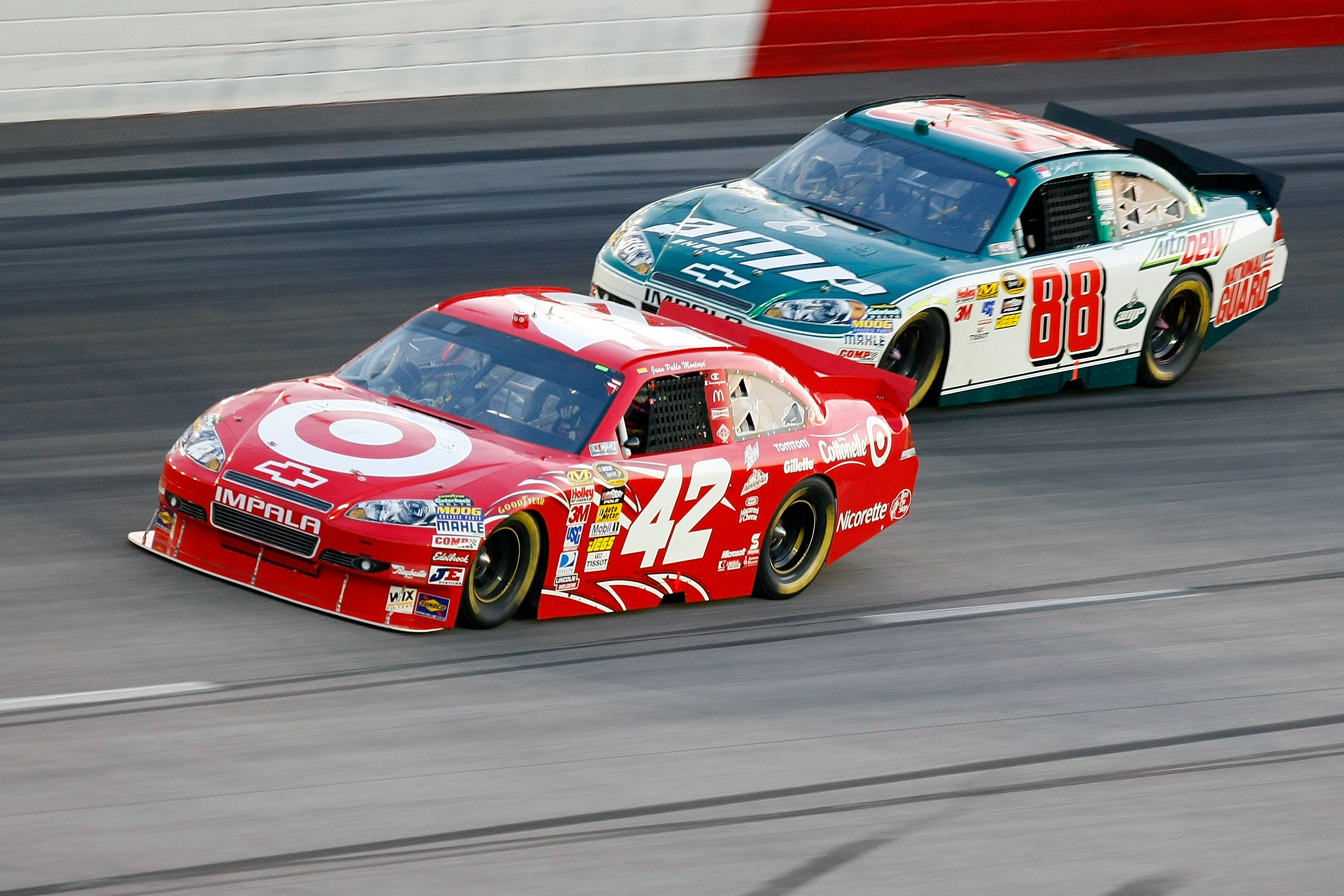DARLINGTON, SC - MAY 08:  Juan Pablo Montoya, driver of the #42 Target Dodge leads Dale Earnhardt Jr., driver of the #88 AMP Energy / National Guard Chevrolet, during the NASCAR Sprint Cup series SHOWTIME Southern 500 at Darlington Raceway on May 8, 2010